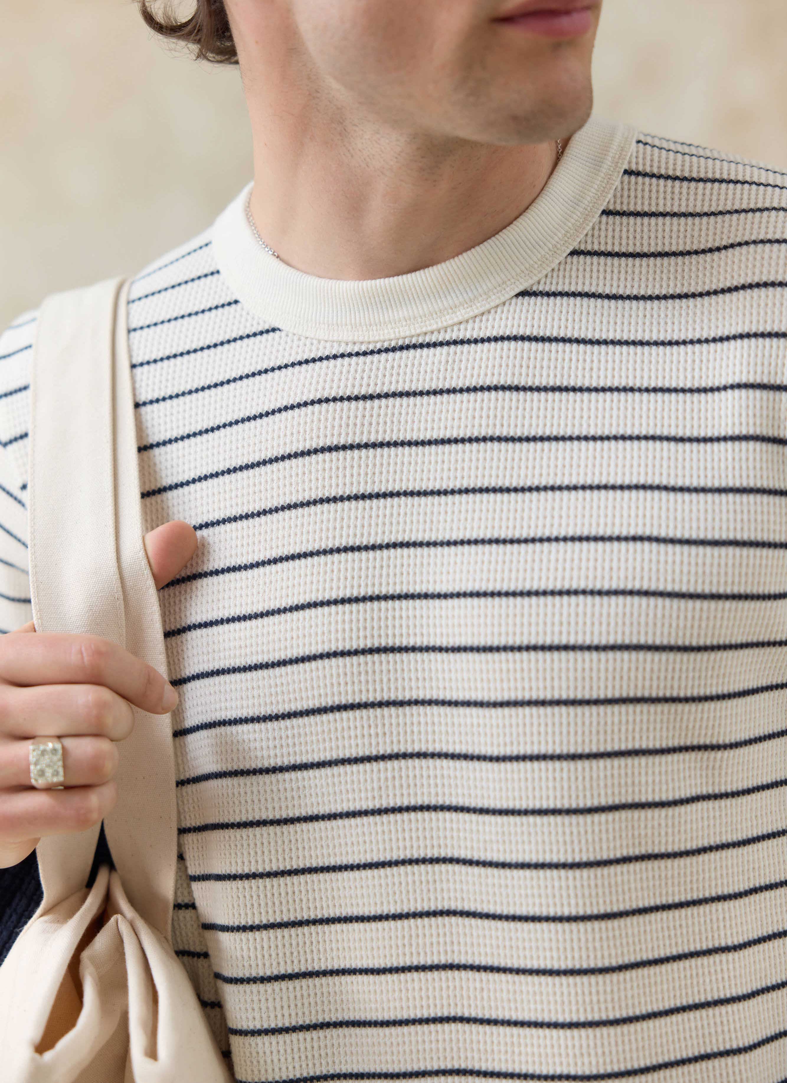 Textured cream and navy stripes on the organic cotton Percival Ernie Waffle T-Shirt with a ribbed neck.