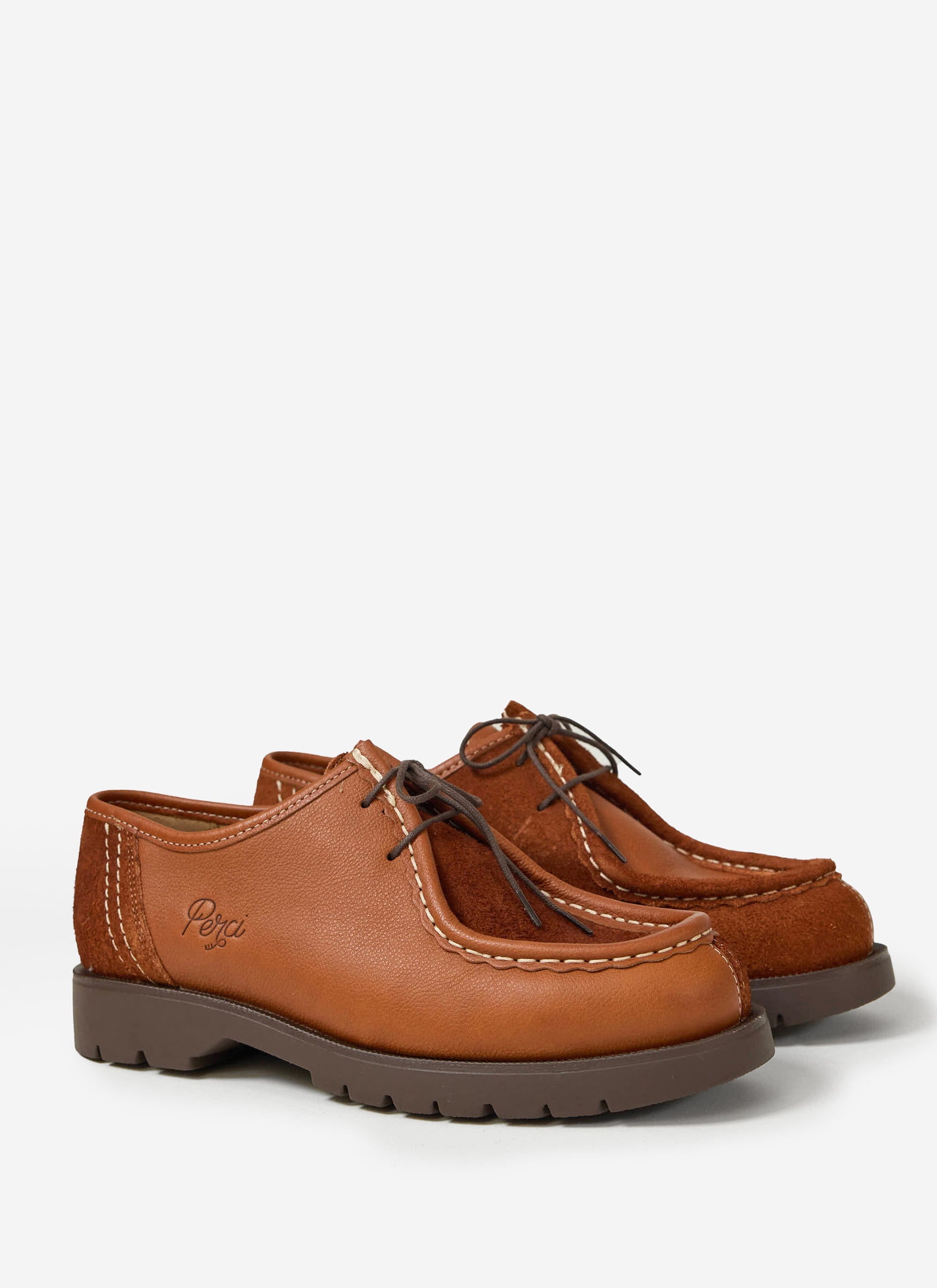The Percival x Kleman Padror shoe in cognac, featuring a patchwork design of leather and suede on a chunky rubber sole.