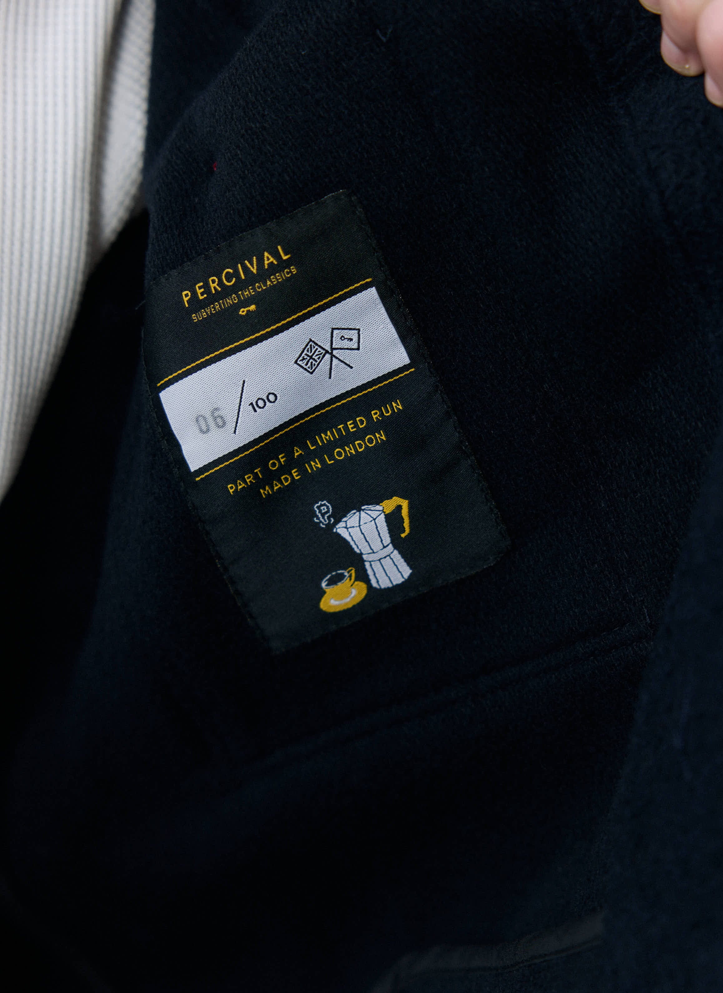 Close up of the internal Percival label on the Navy Casentino Wool Blanket Overshirt, showing it's a limited edition.