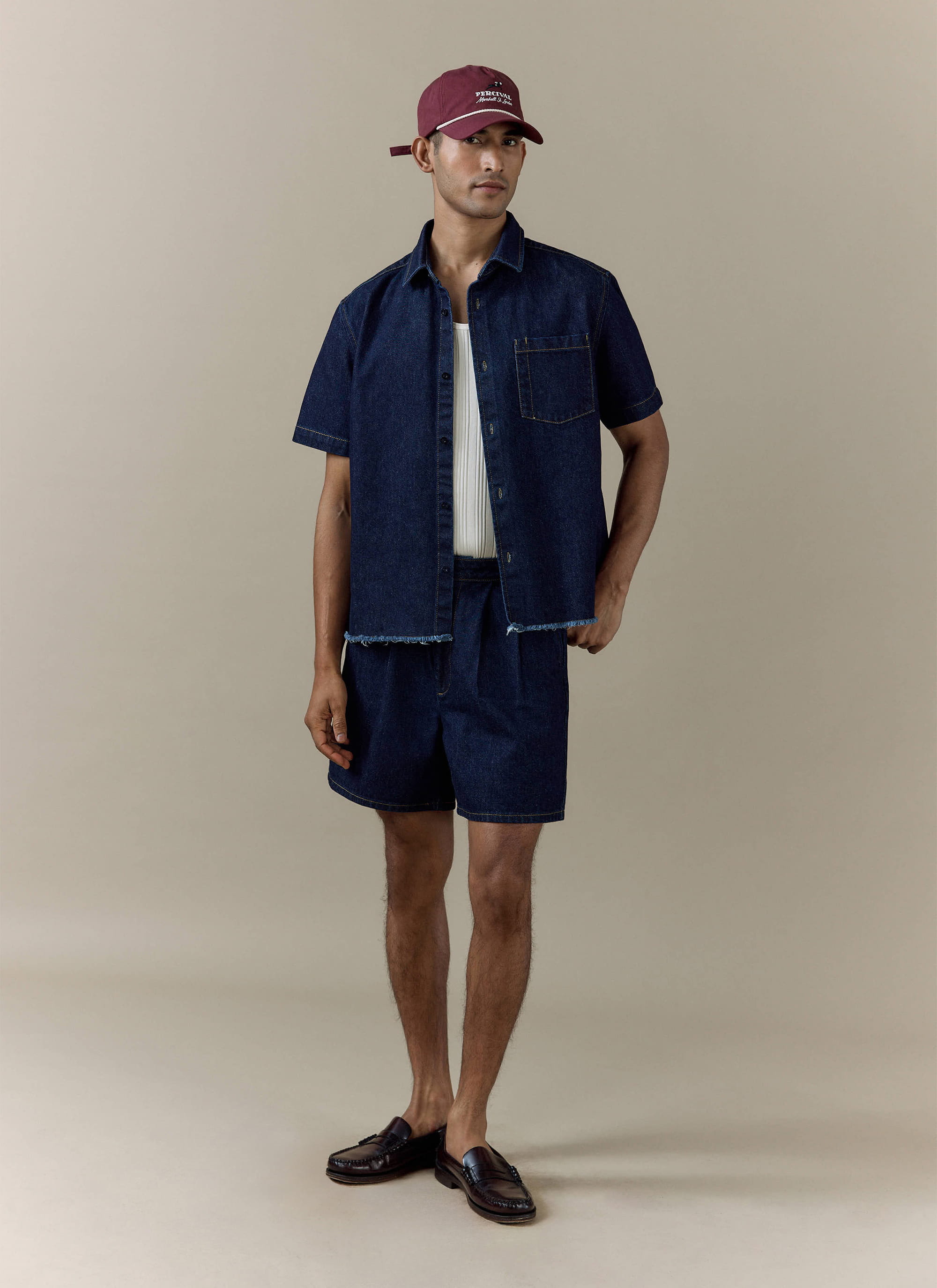 Percival dark indigo Harley denim cropped shirt paired with matching Blake double pleated shorts.