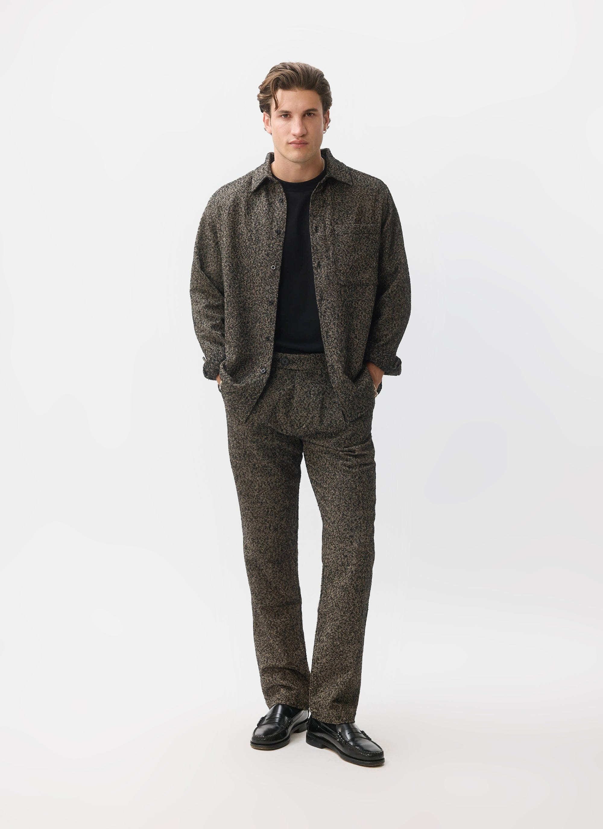 A model wears the Percival Blyton Long Sleeve Shirt and matching trousers in grey as a co-ord against a white background.