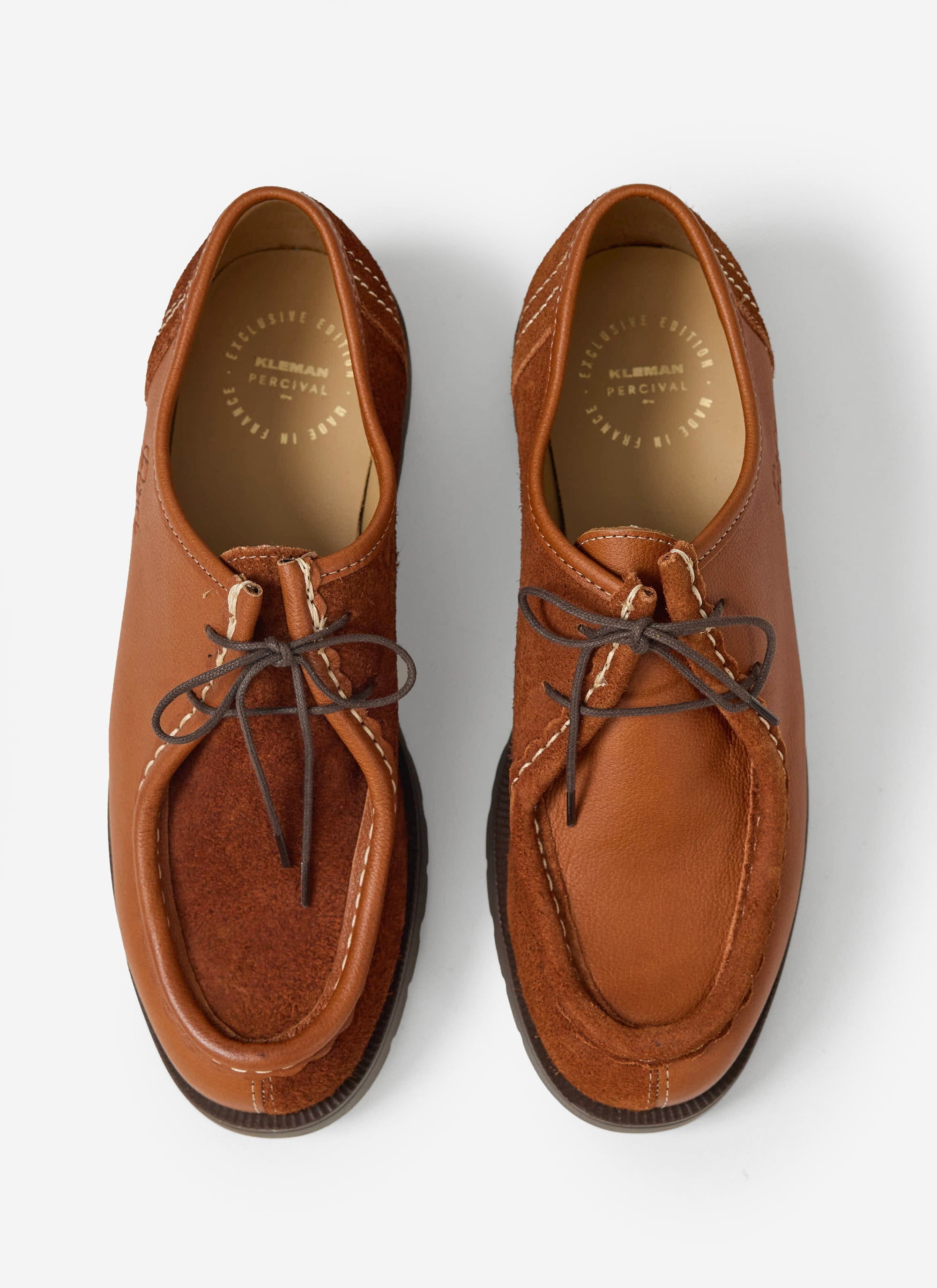 A top-down shot of the Kleman x Percival Padror Patchwork shoes in cognac, showing the leather and suede yin-yang design.