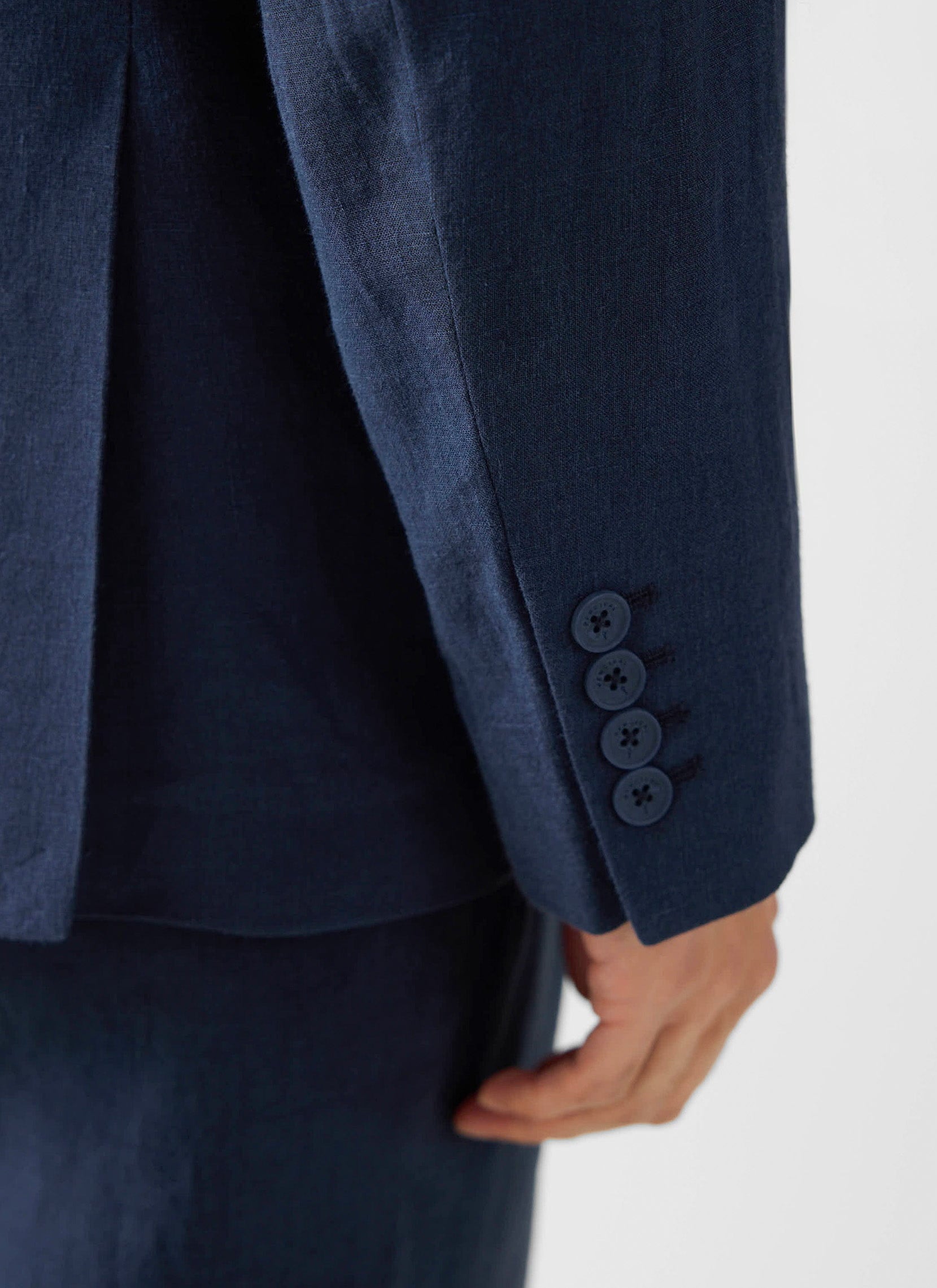 Close up of the navy linen Clifton Double Breasted Blazer from Percival, showing the four-button cuff detail.