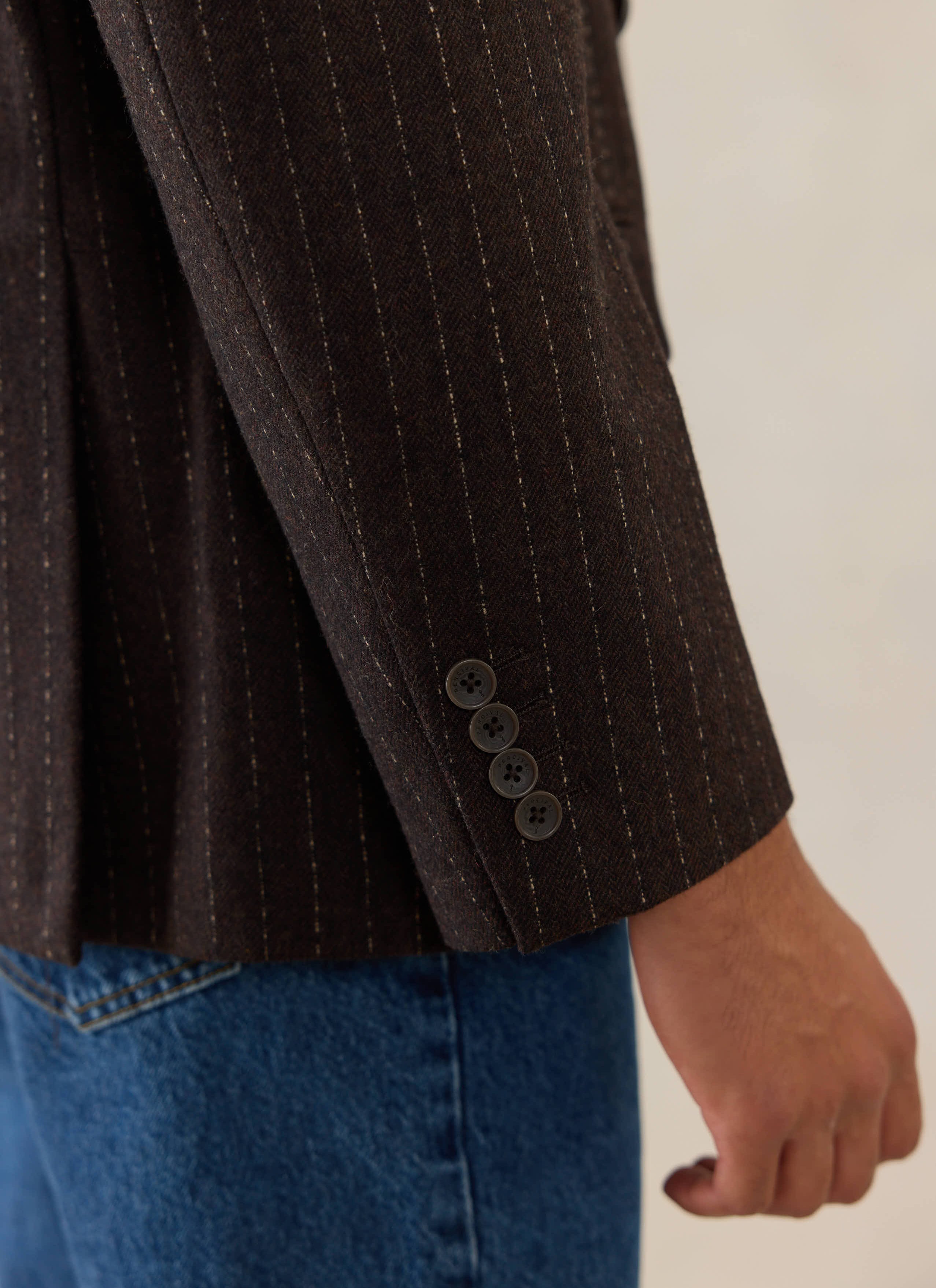 Percival Clifton Pinstripe Double Breasted Blazer in espresso, showing the buttoned cuff and textured wool fabric.