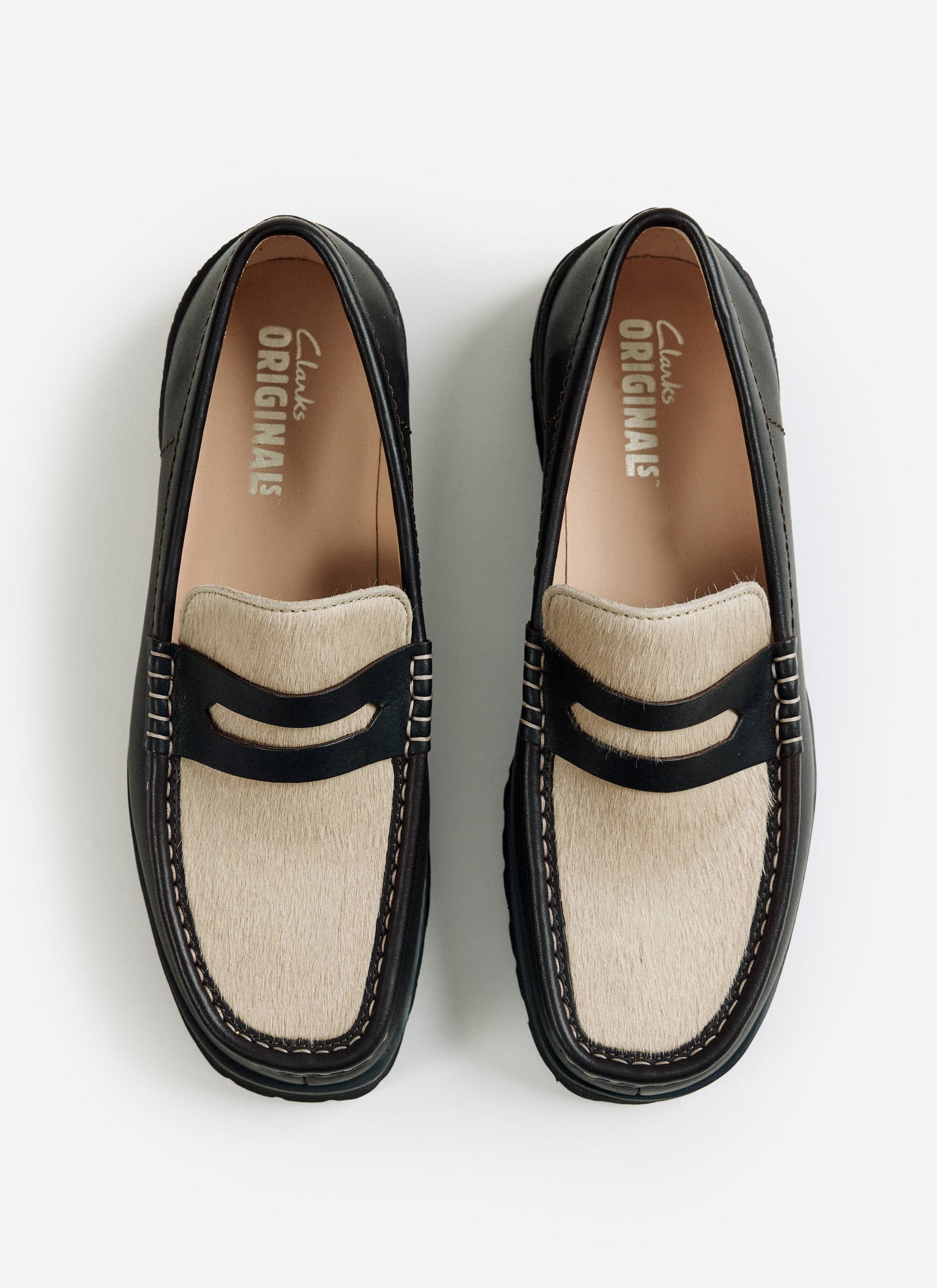 A top-down view of the brown Clarks Originals Yukoner Penny Loafers with a maple hair-on vamp from Percival.