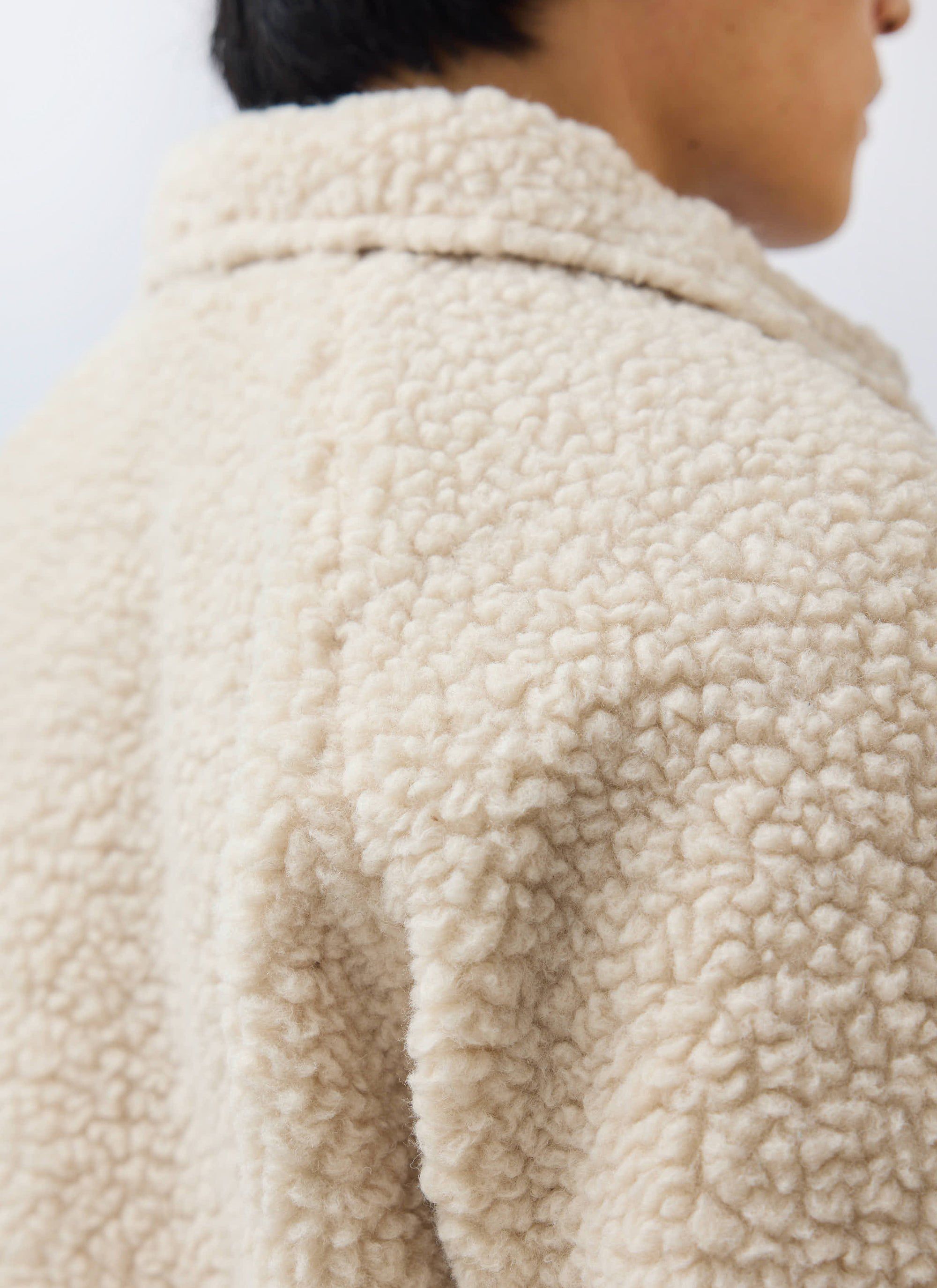A close-up of the ecru wool fleece texture on the back of the Men's Wool Fleece Jacket by Percival.