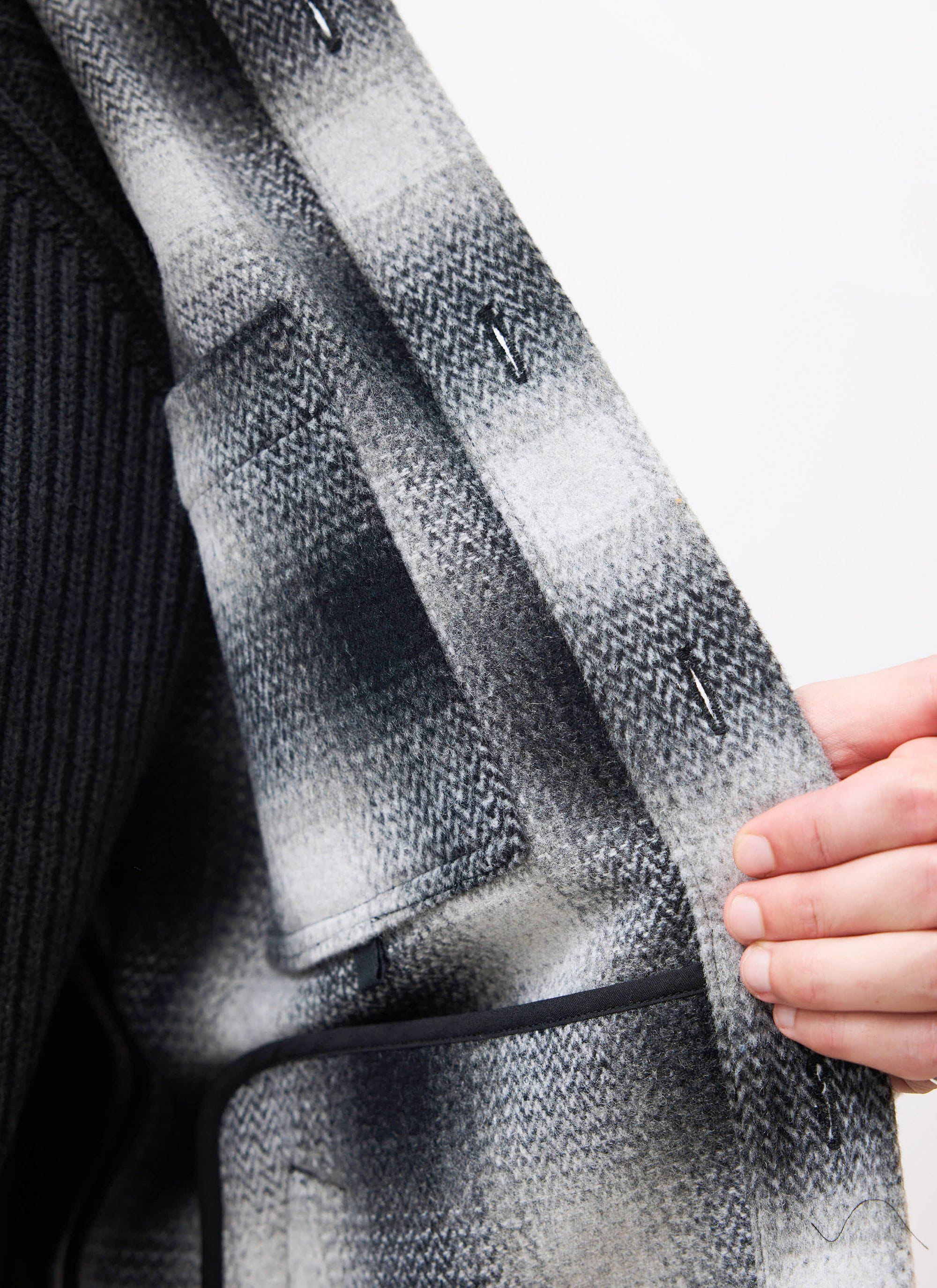 Close-up of the Percival grey Check Overshirt's interior, detailing the wool-blend fabric and internal pockets.