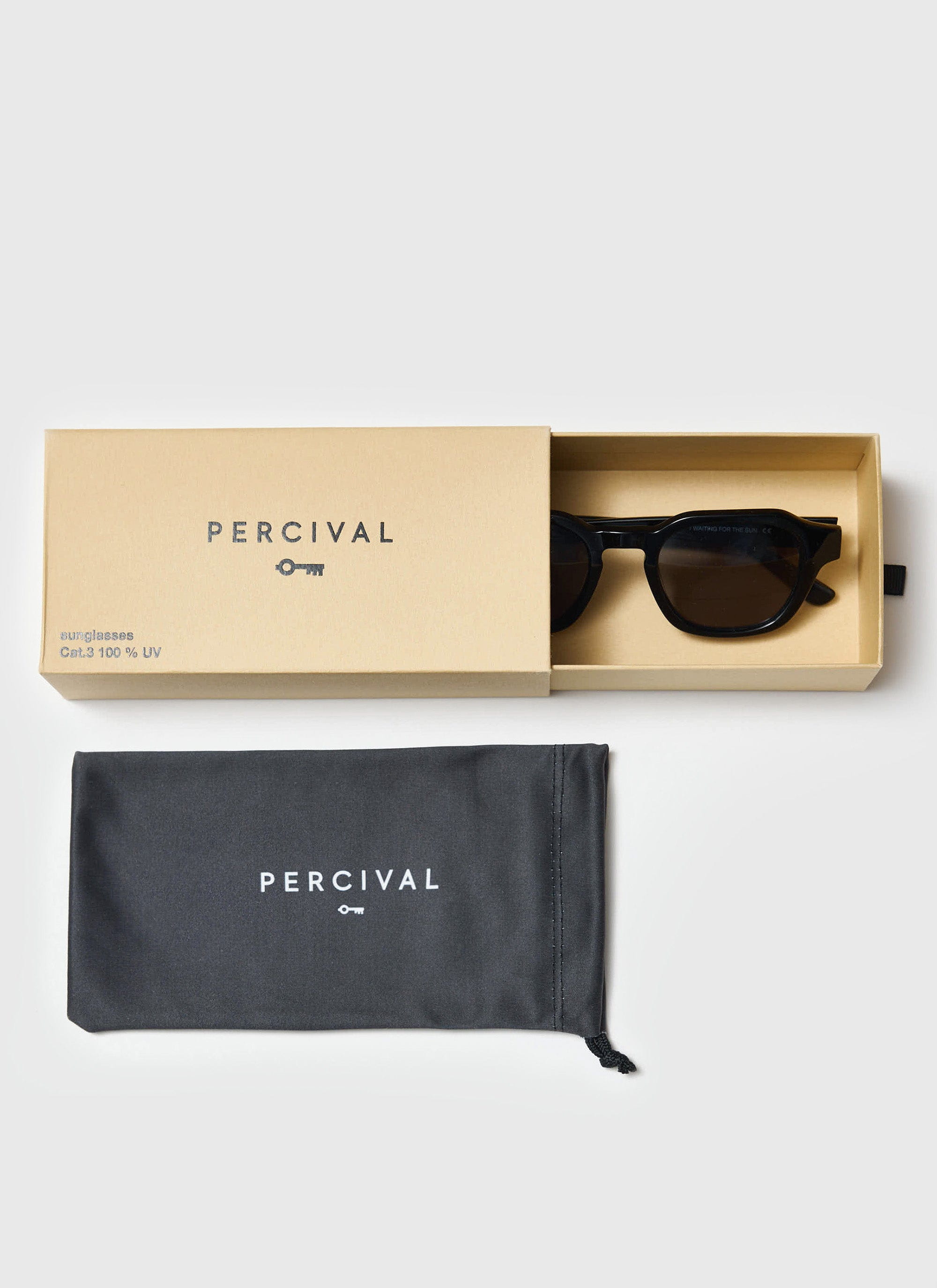 The Percival P001-E2 black sunglasses shown in their branded box, alongside the protective black pouch.