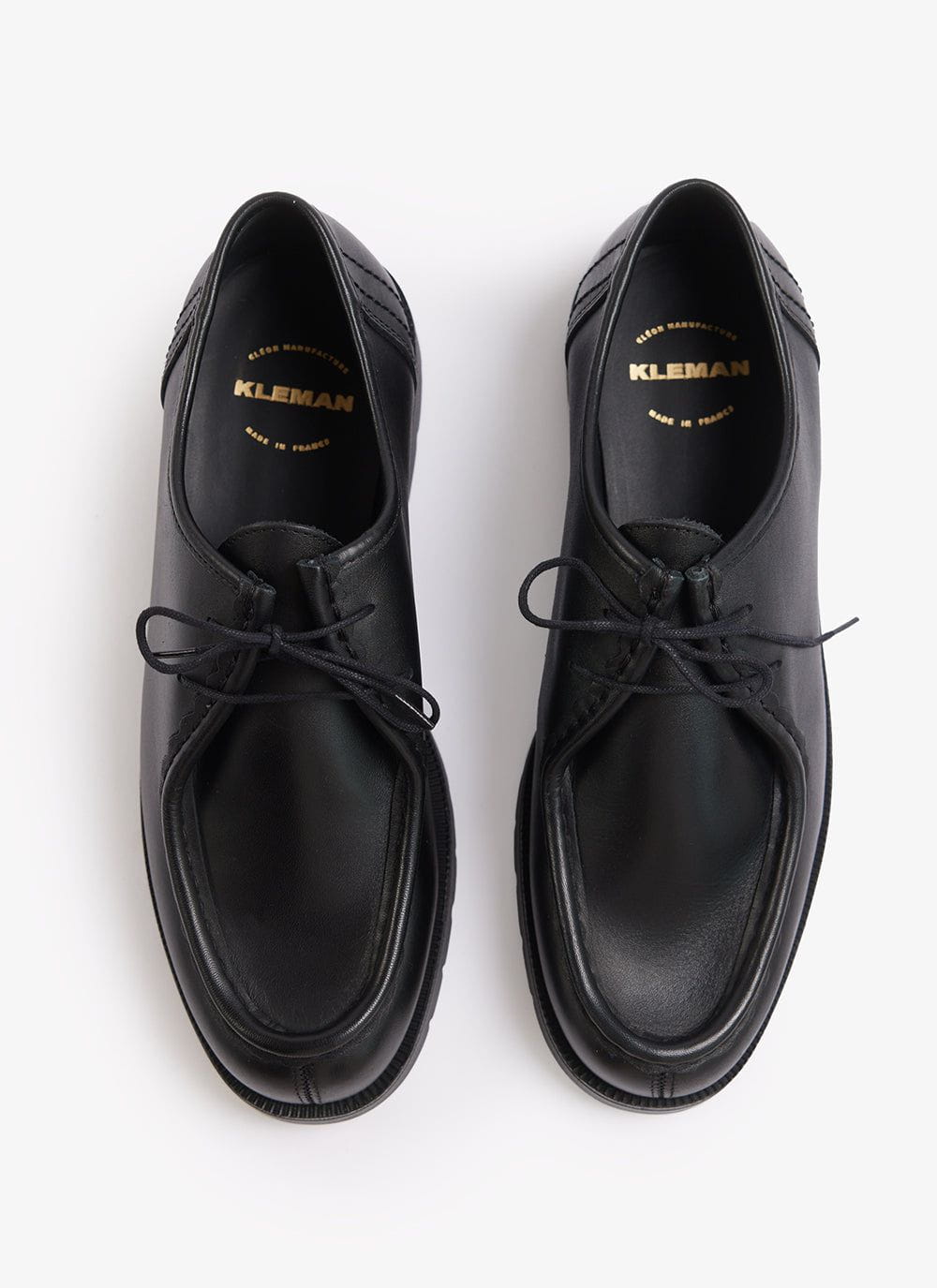 A pair of black Kleman Padror leather shoes from Percival, seen from above against a white background.