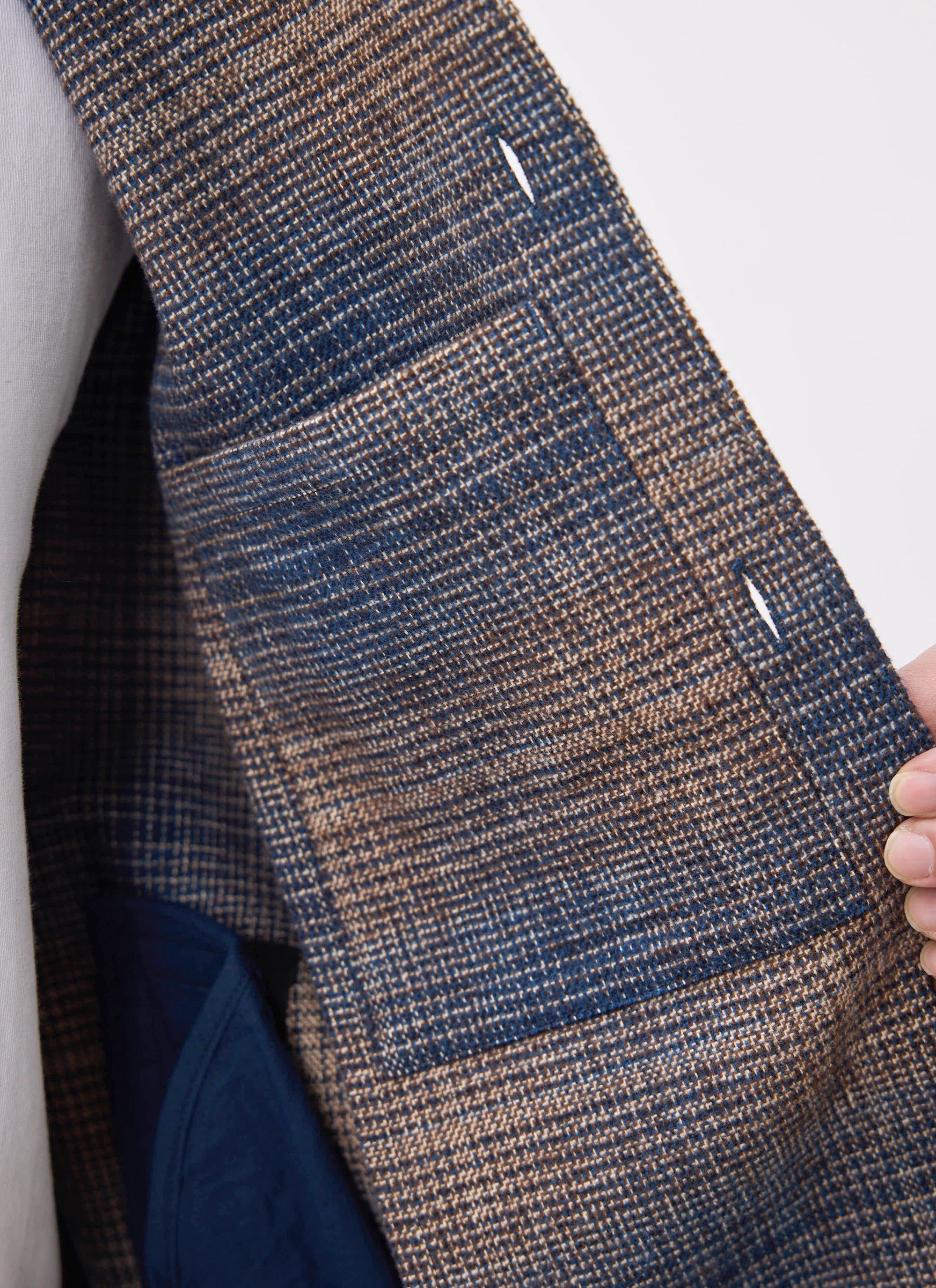 Detail shot of the Percival Luton Check Overshirt in brown, highlighting the internal chest pocket and fabric texture.