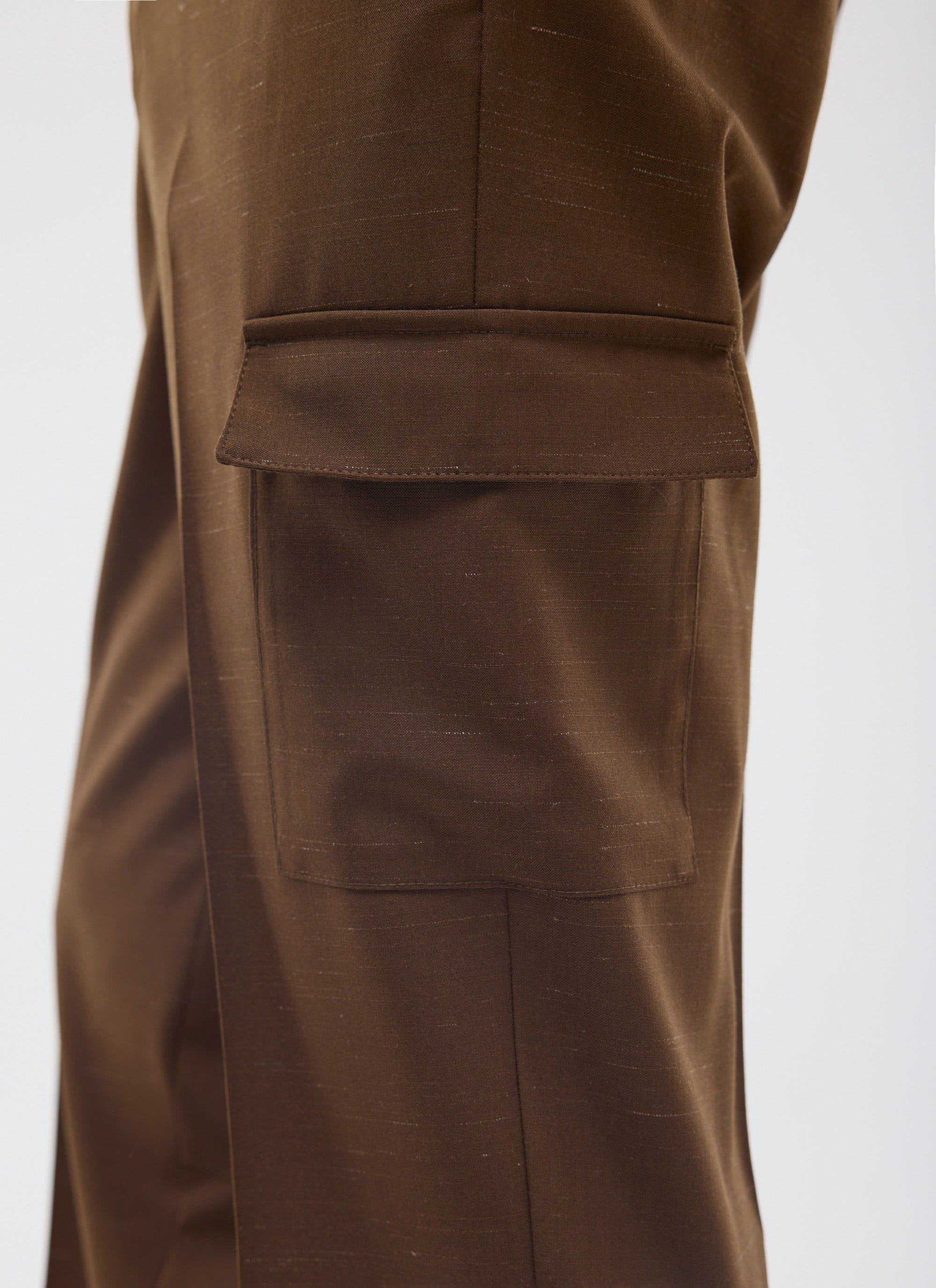 Close-up of the Percival Trentino Tailored Trousers in brown, showing the patch pocket detail and textured wool-blend fabric.