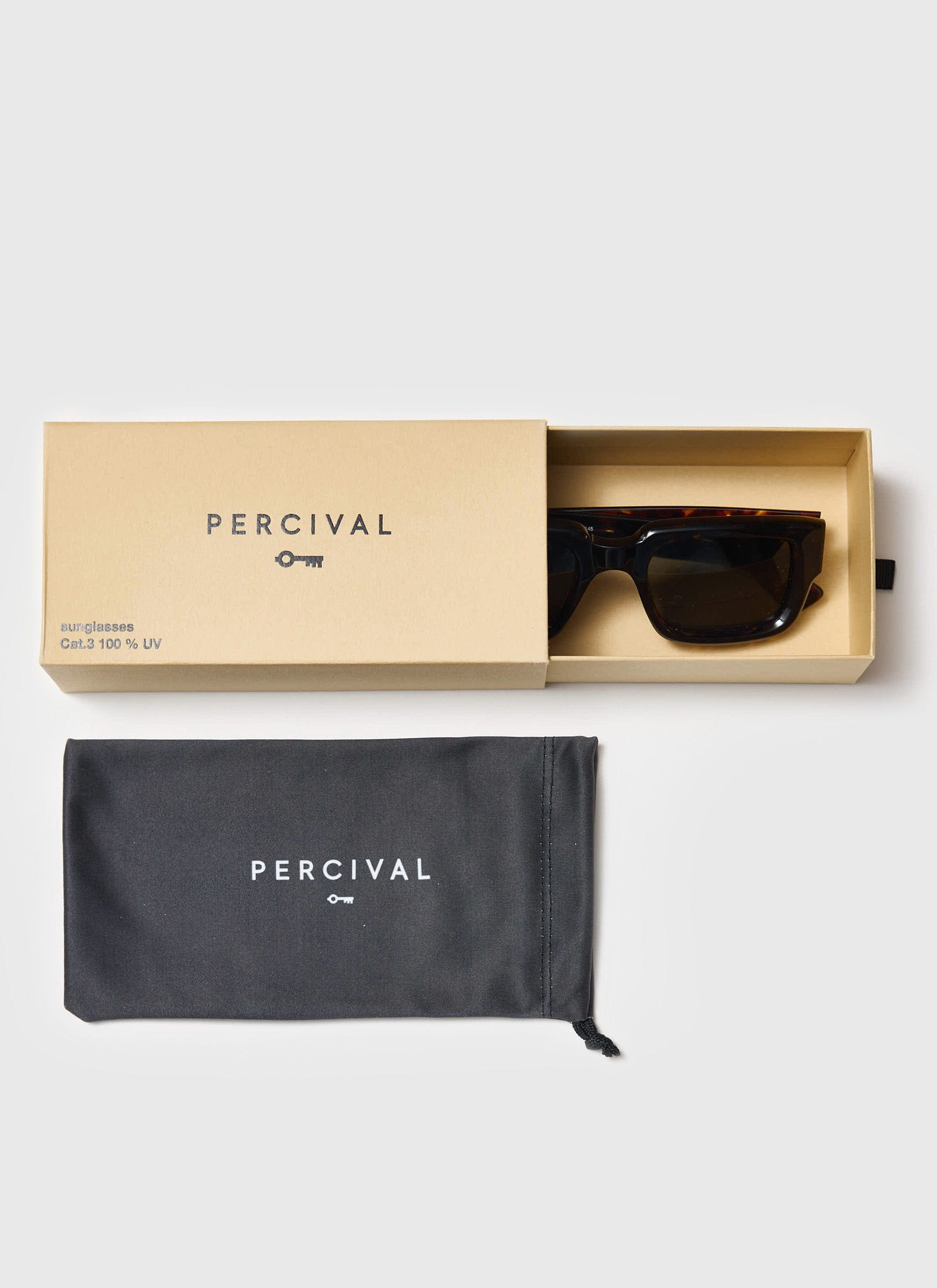 The Percival Demi Brown Tortoise sunglasses presented in their branded box with the matching black soft pouch.