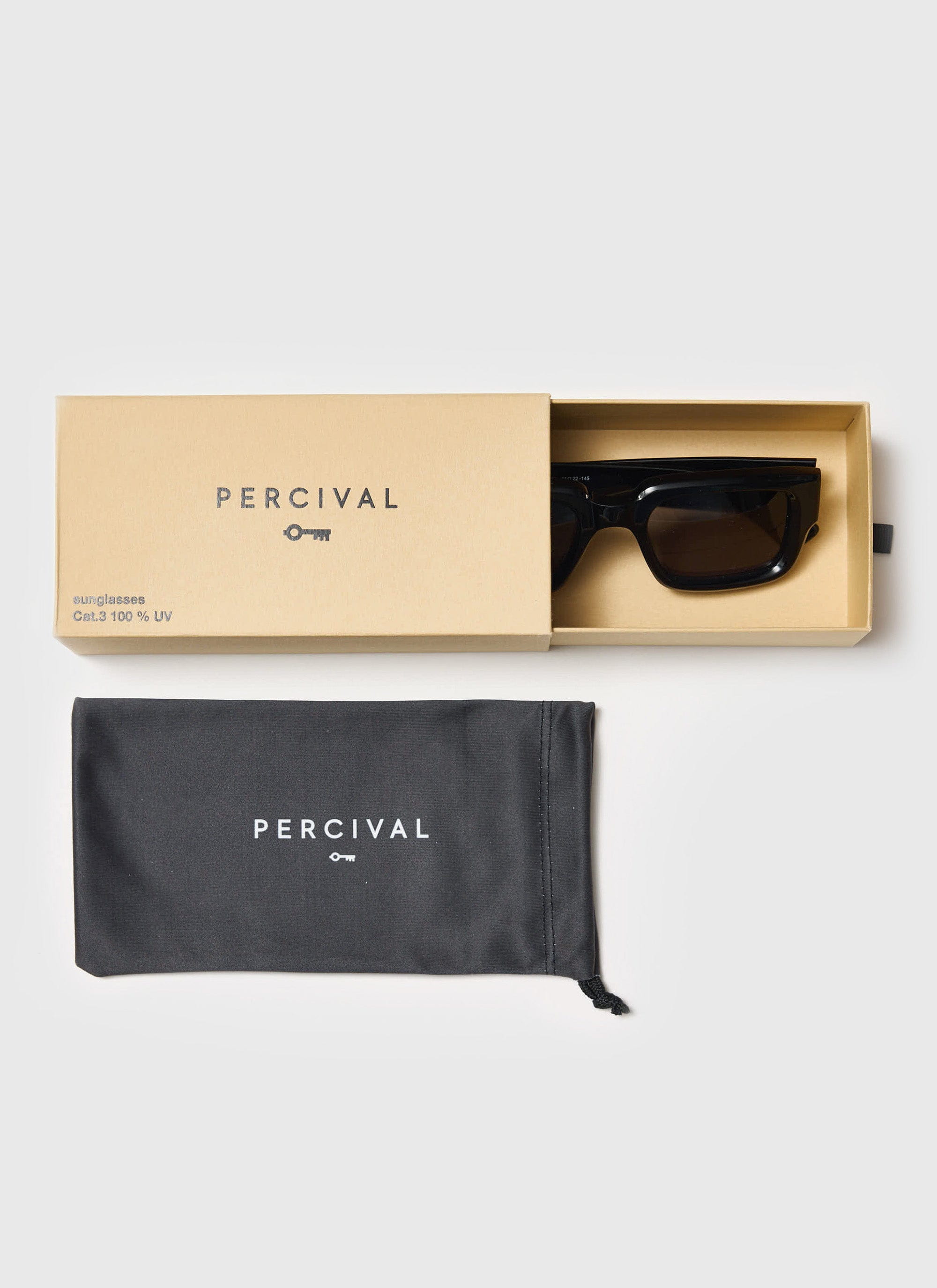 A pair of black Percival sunglasses in their branded box, alongside the matching dark grey protective pouch.