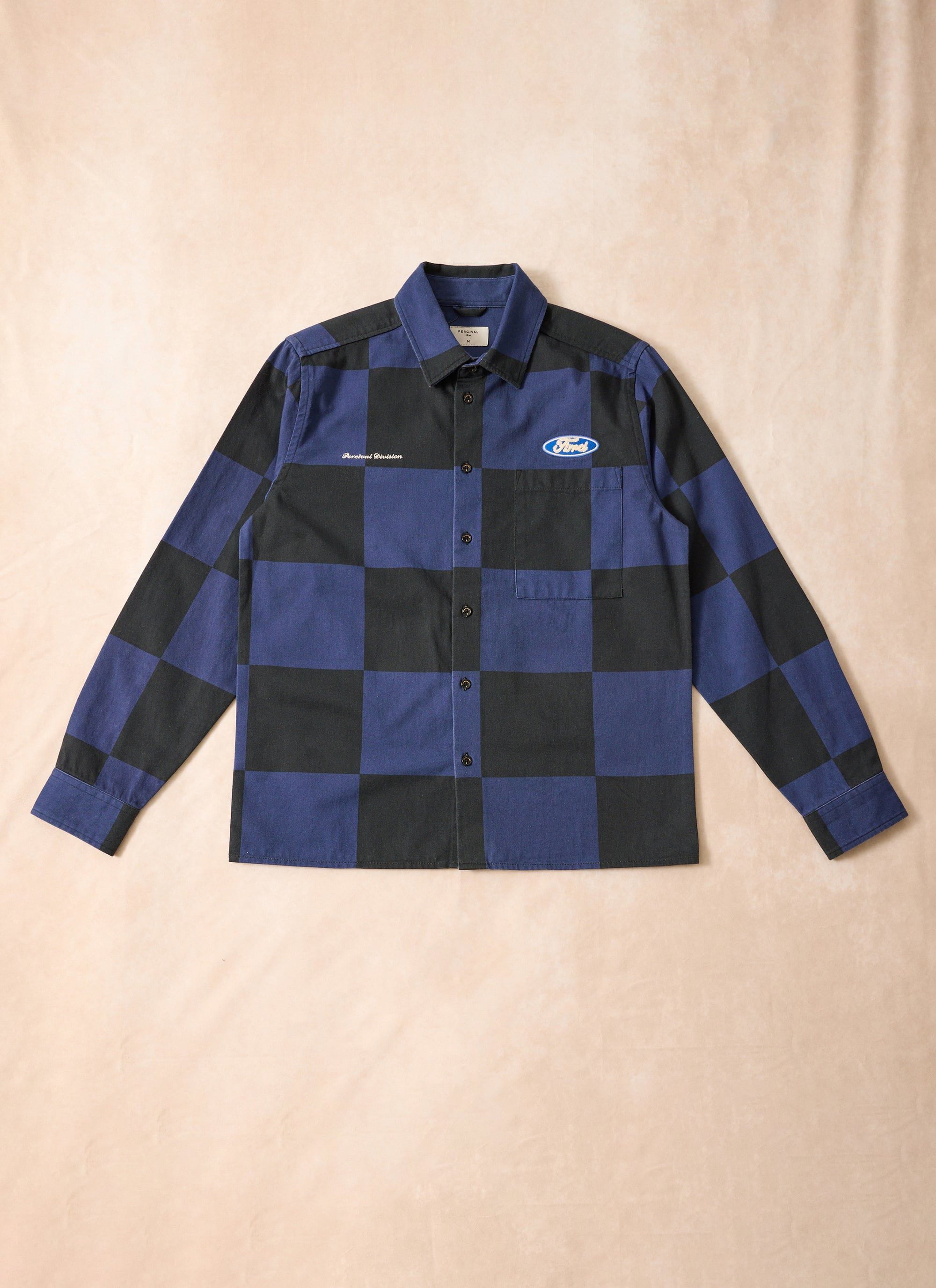 Percival x Ford navy and black checkerboard overshirt with embroidered logos, shown laid flat.