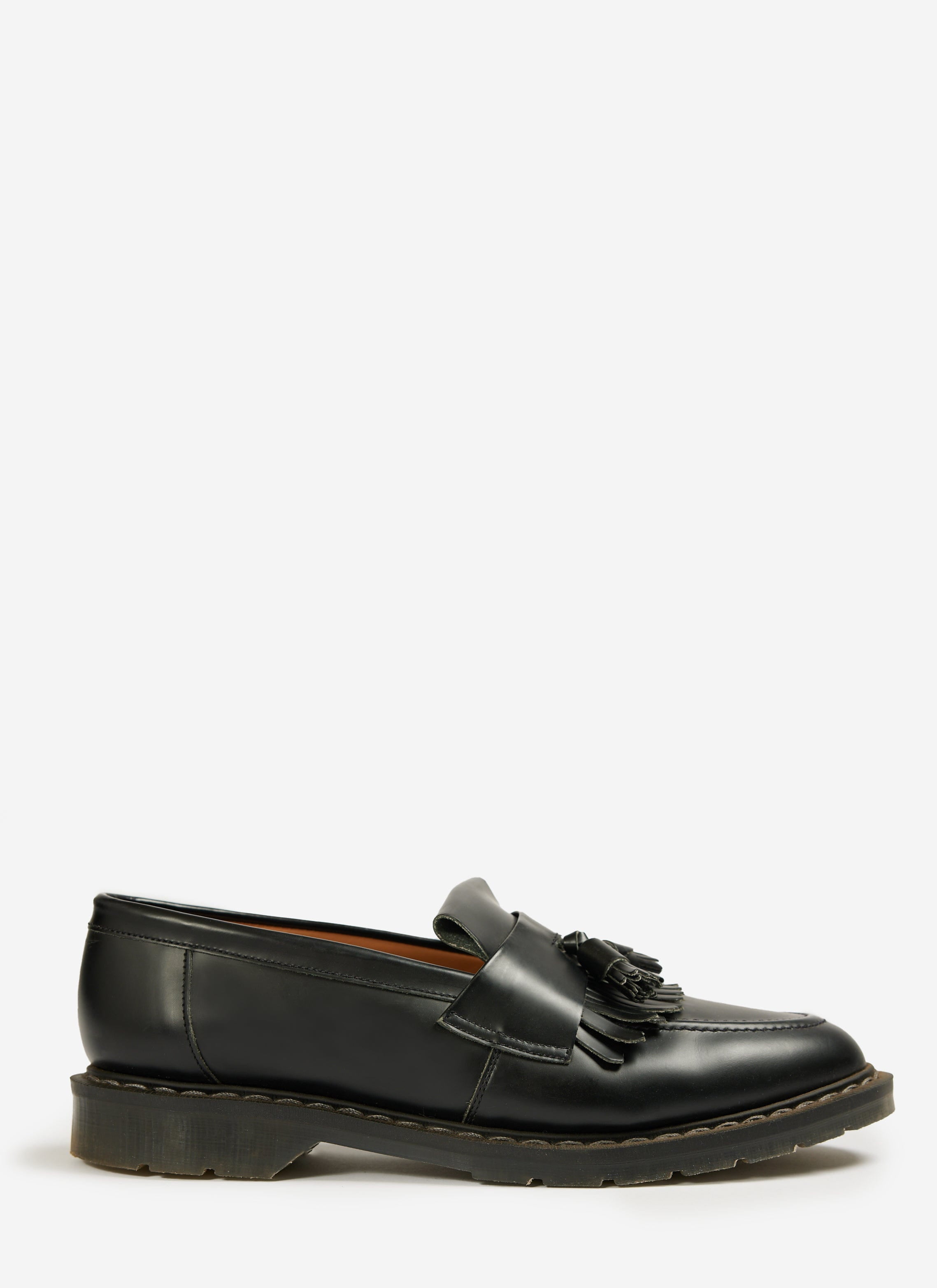 Percival's black hi-shine leather tassel loafer from the Solovair collaboration, shown from the side on a white background.