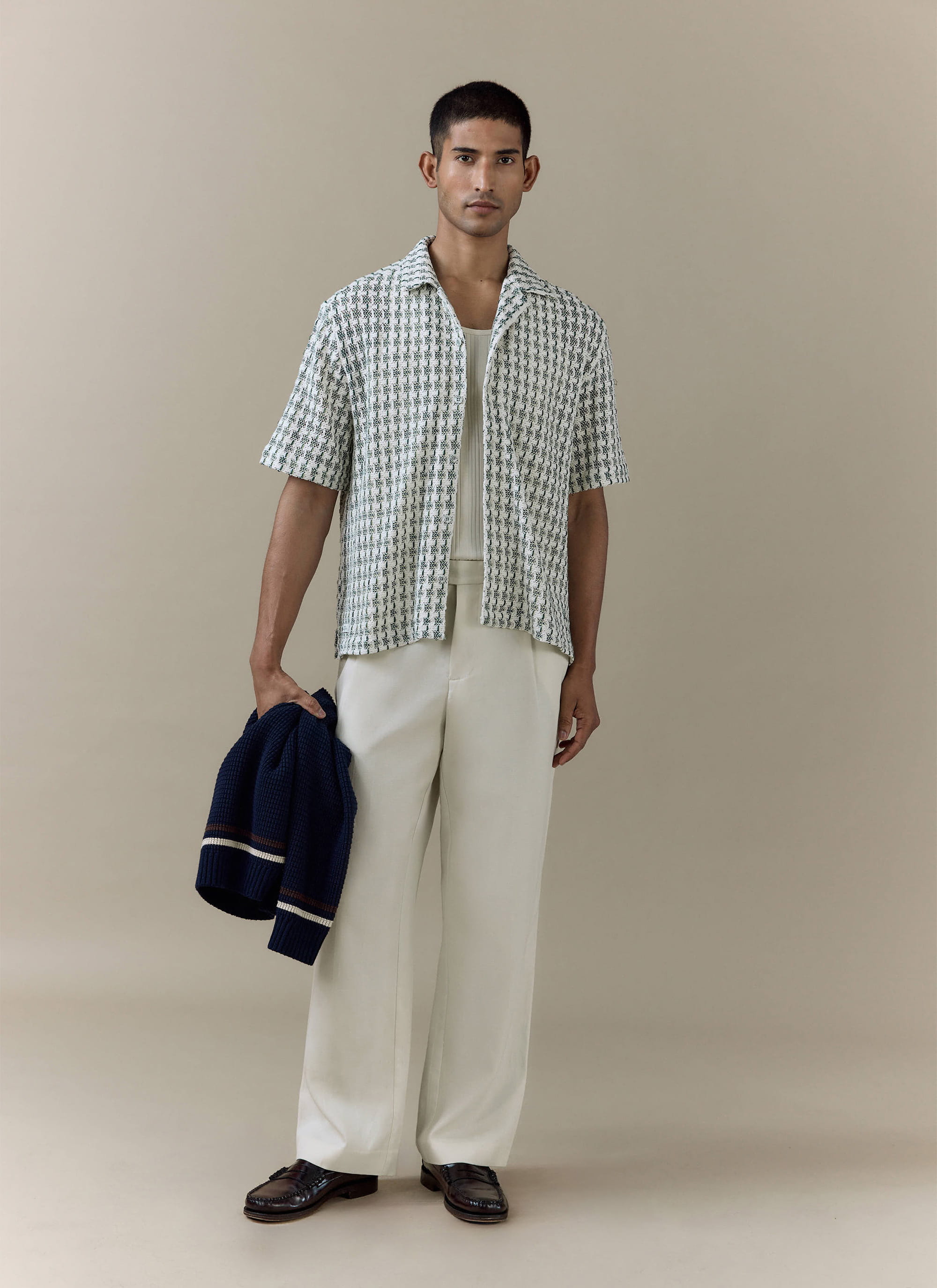 Percival green Freddie Crochet Boxy Shirt in a textured knit, styled on a model with cream trousers and a navy jumper.
