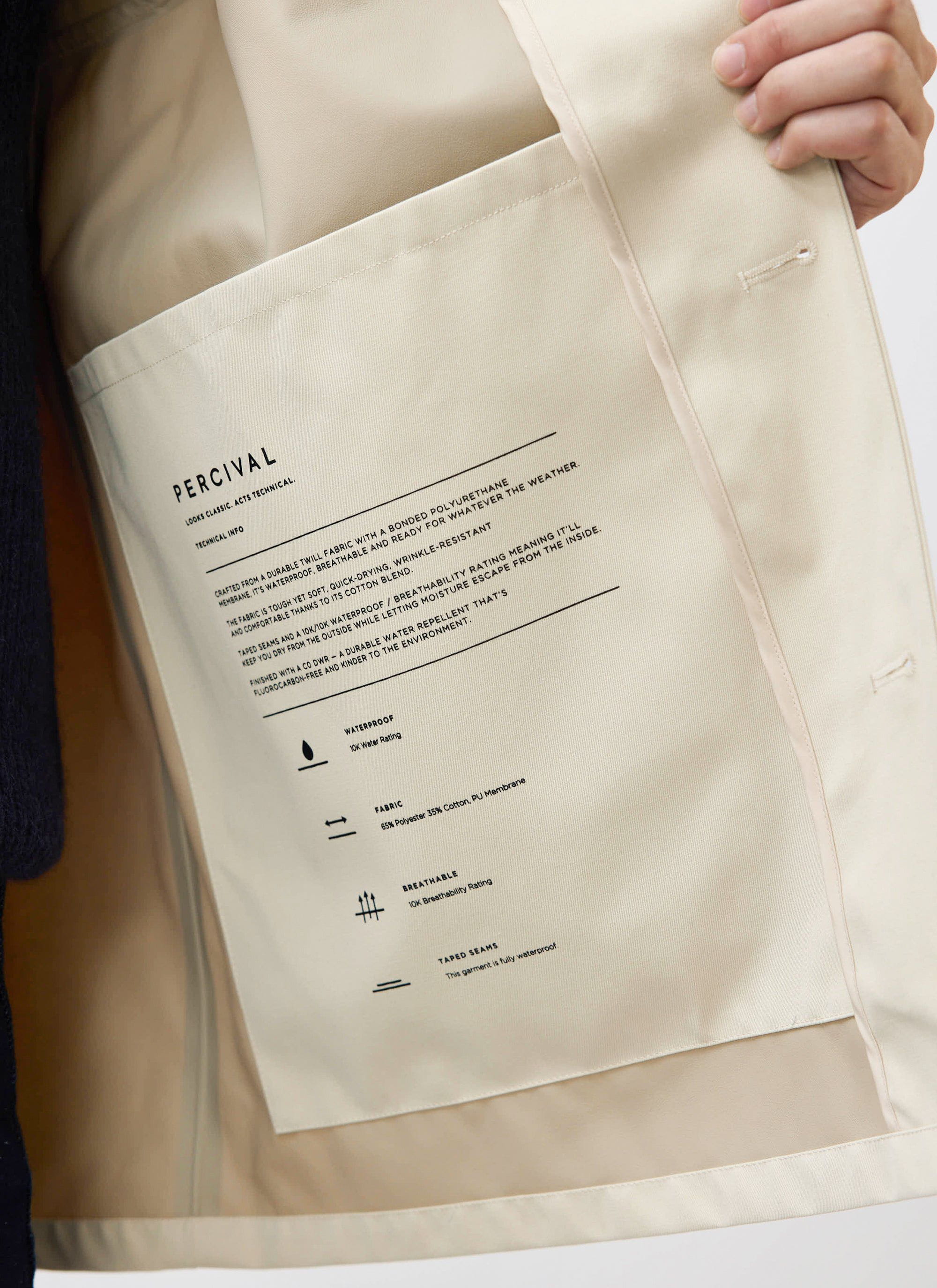 A close-up of the large internal pocket on the Percival Sherlock Trench Coat, displaying the technical waterproof features.