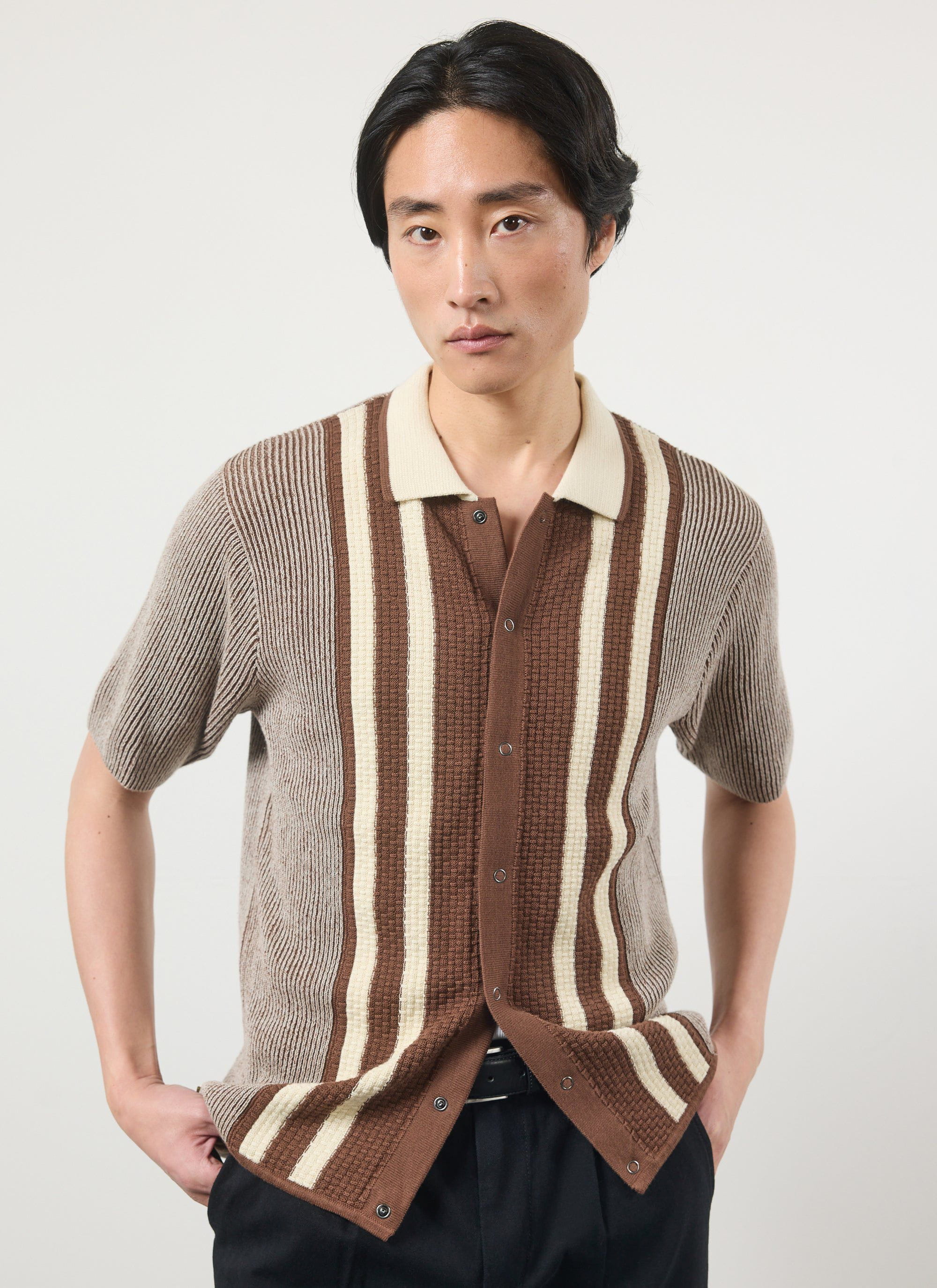 A model wears the Percival Teramo Knitted Polo Shirt in ecru and brown stripes against a white background.