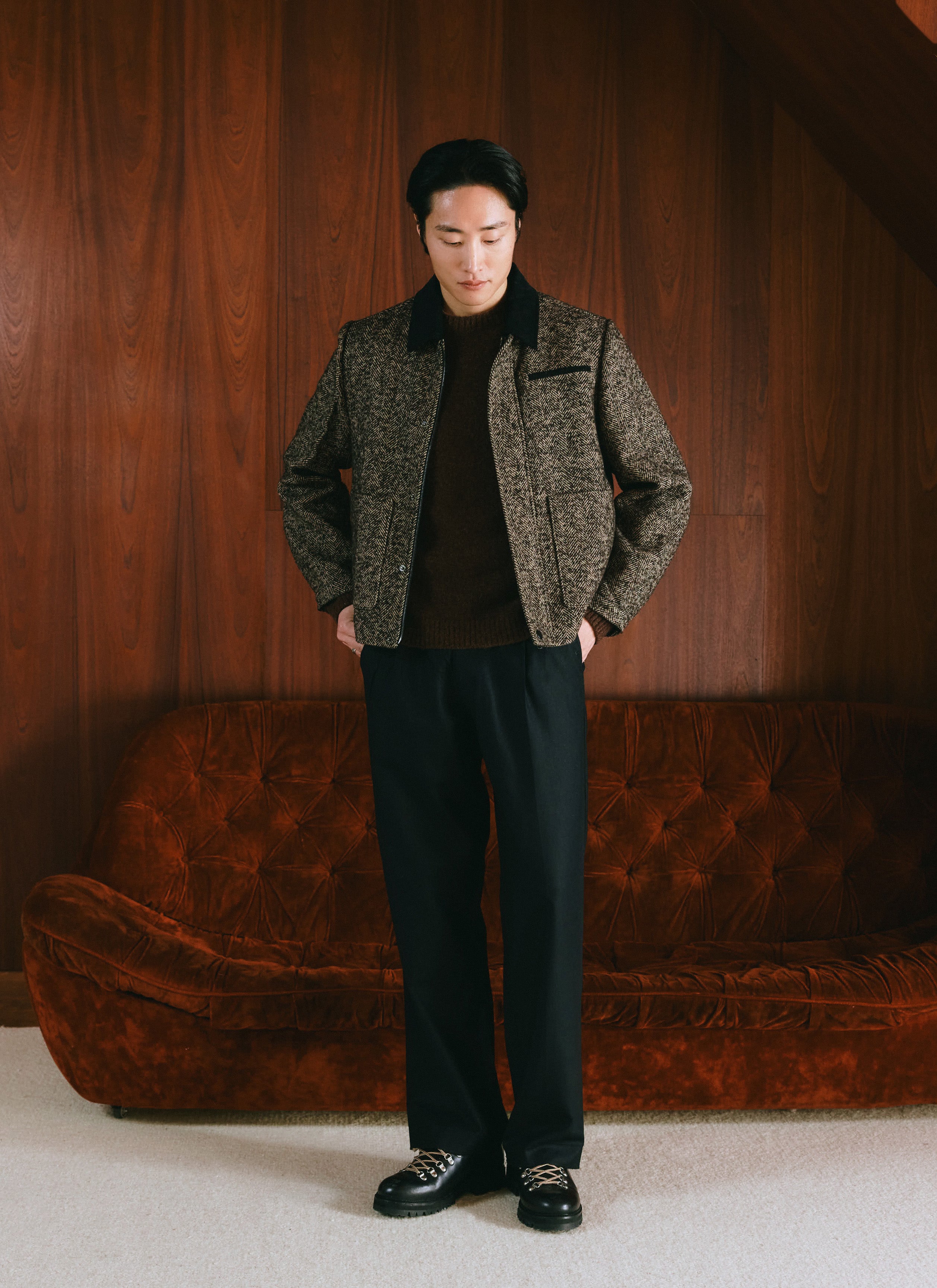 A model wearing the brown Percival herringbone wool blend boxy jacket with a contrast collar over a dark knit.
