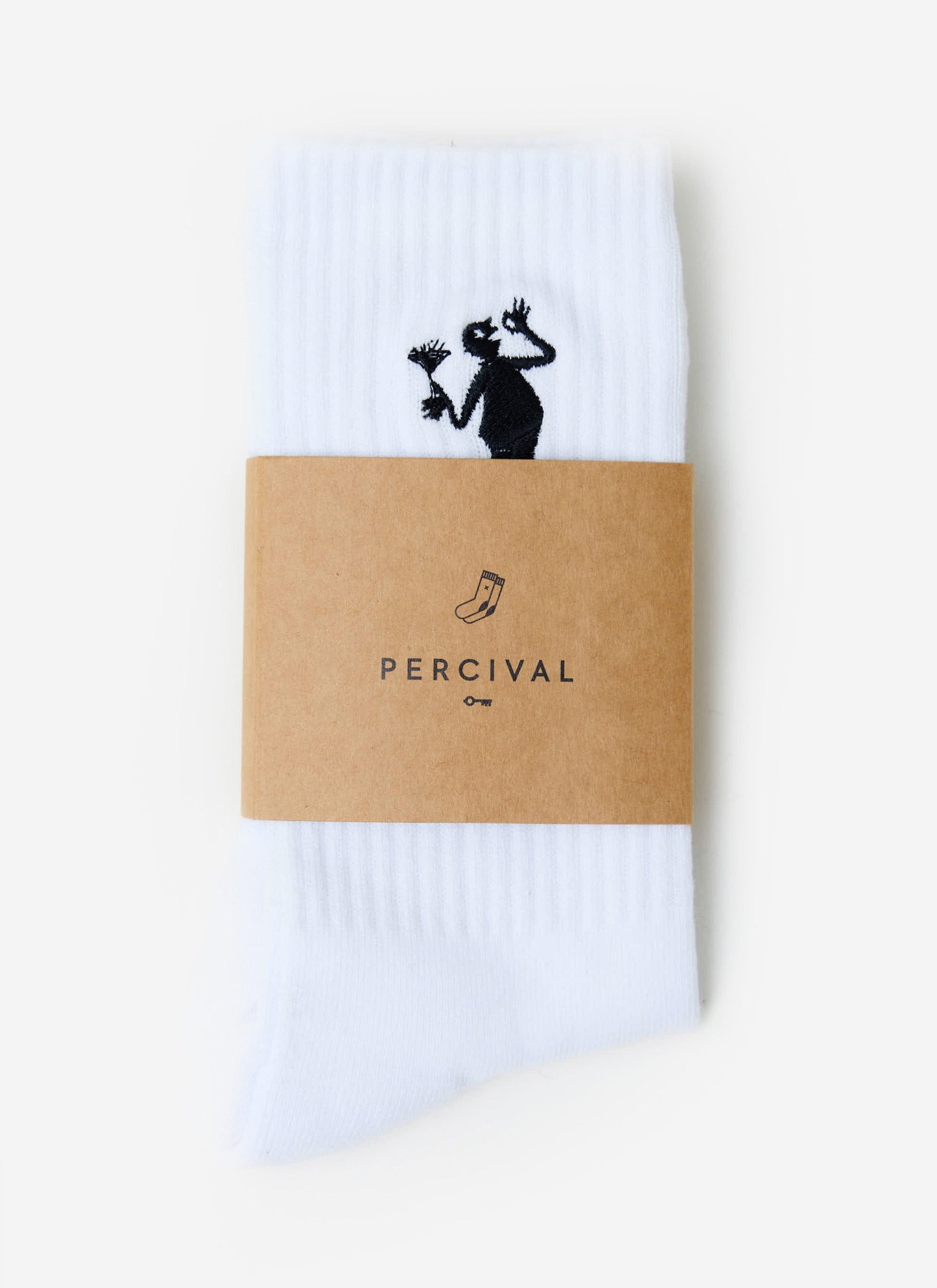 The Percival Carlo Mixologist embroidered socks in white, neatly folded and displayed in their branded cardboard sleeve.