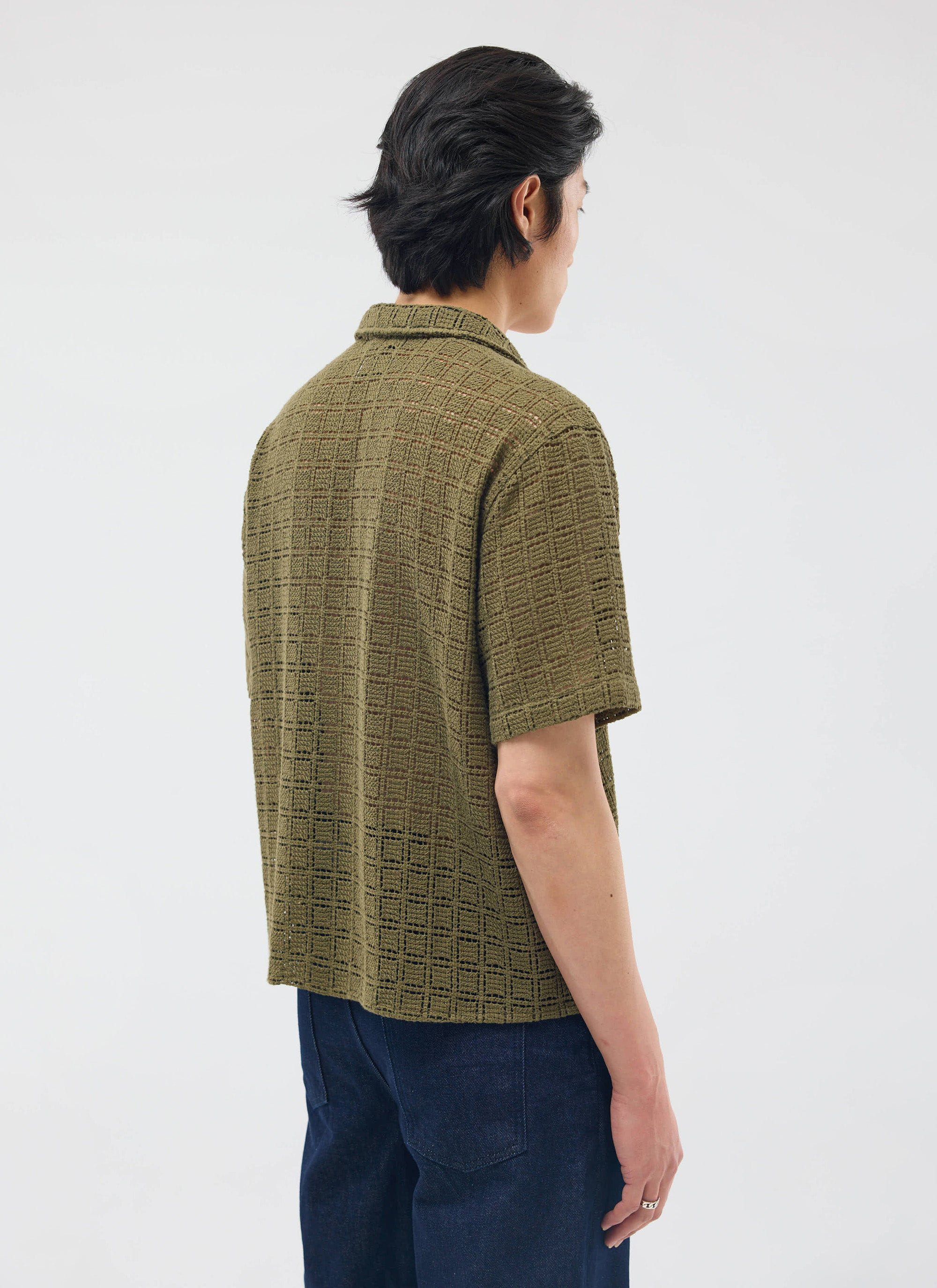 A model seen from behind, wearing the olive green Palermo Crochet Cuban Shirt from Percival.