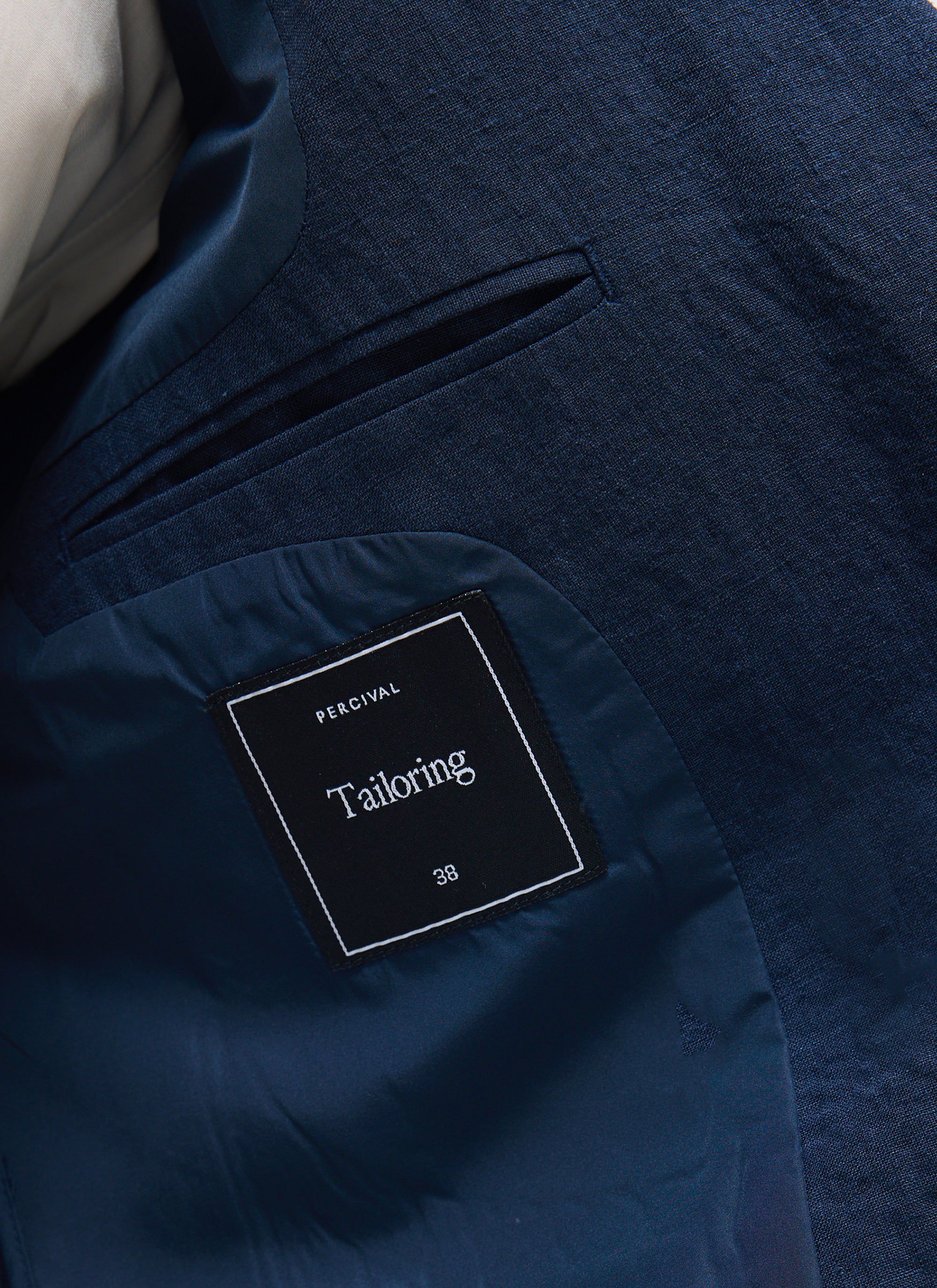 Close up shot of the inner pocket and branding label on the Percival Tailored Double Breasted Blazer in navy linen.