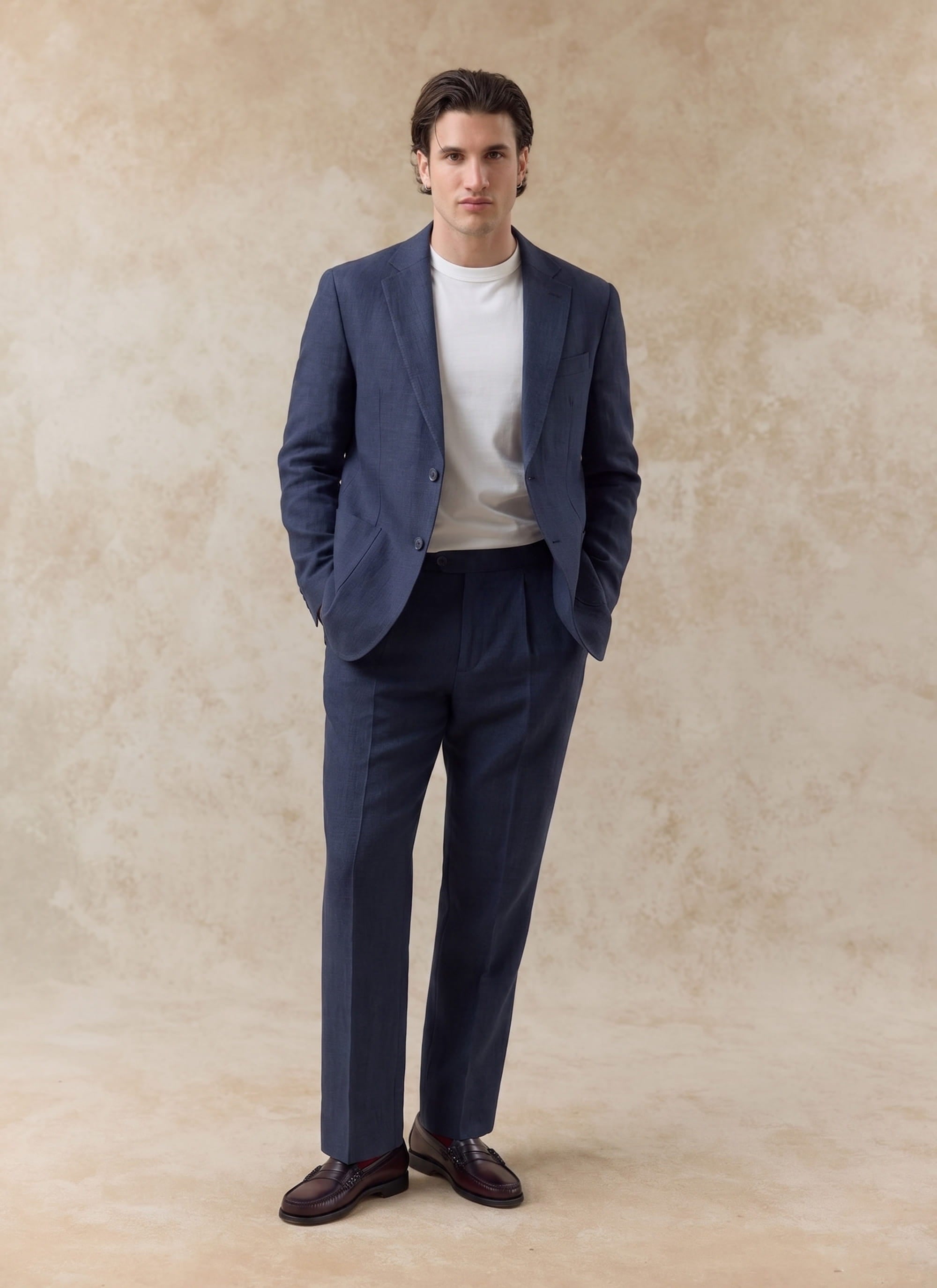 Navy blue Percival Tailored Linen Blazer and matching trousers worn by a model over a plain white t-shirt.