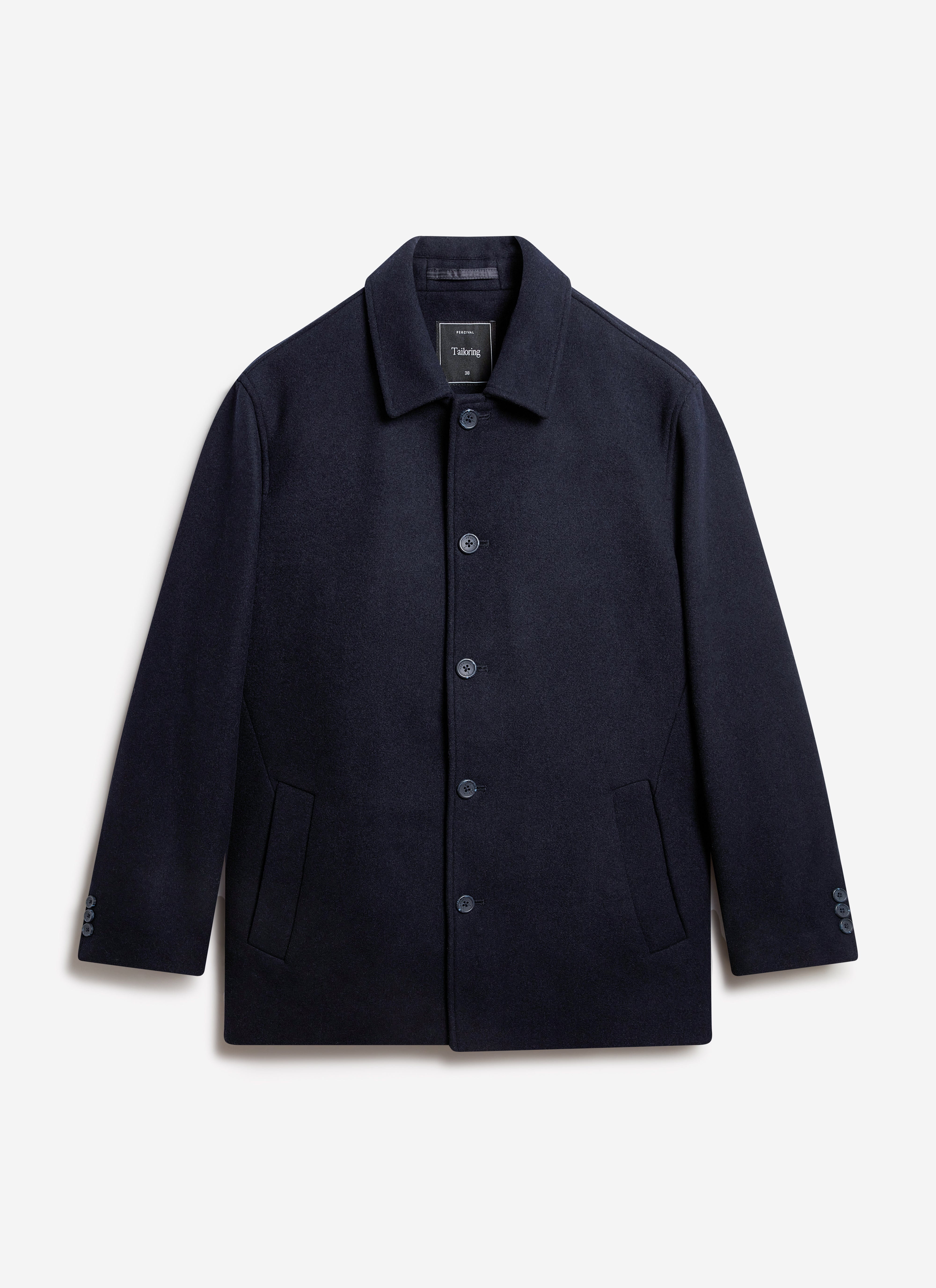 The Percival navy Peacoat in a heavyweight melton wool blend, shot flat against a studio background.