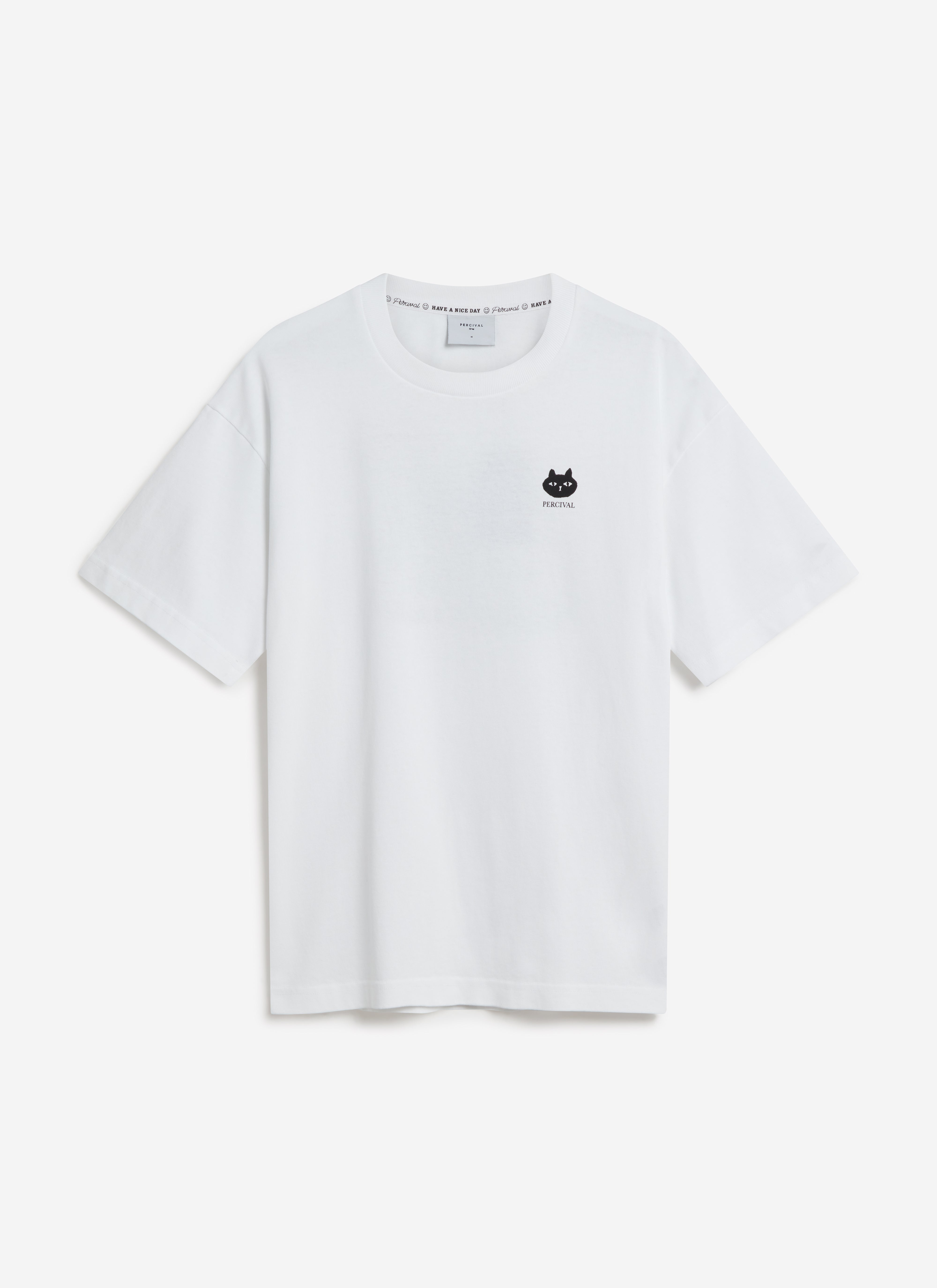A flat lay of the Percival Perci Loaf oversized t-shirt in white organic cotton, showing the small black cat graphic.