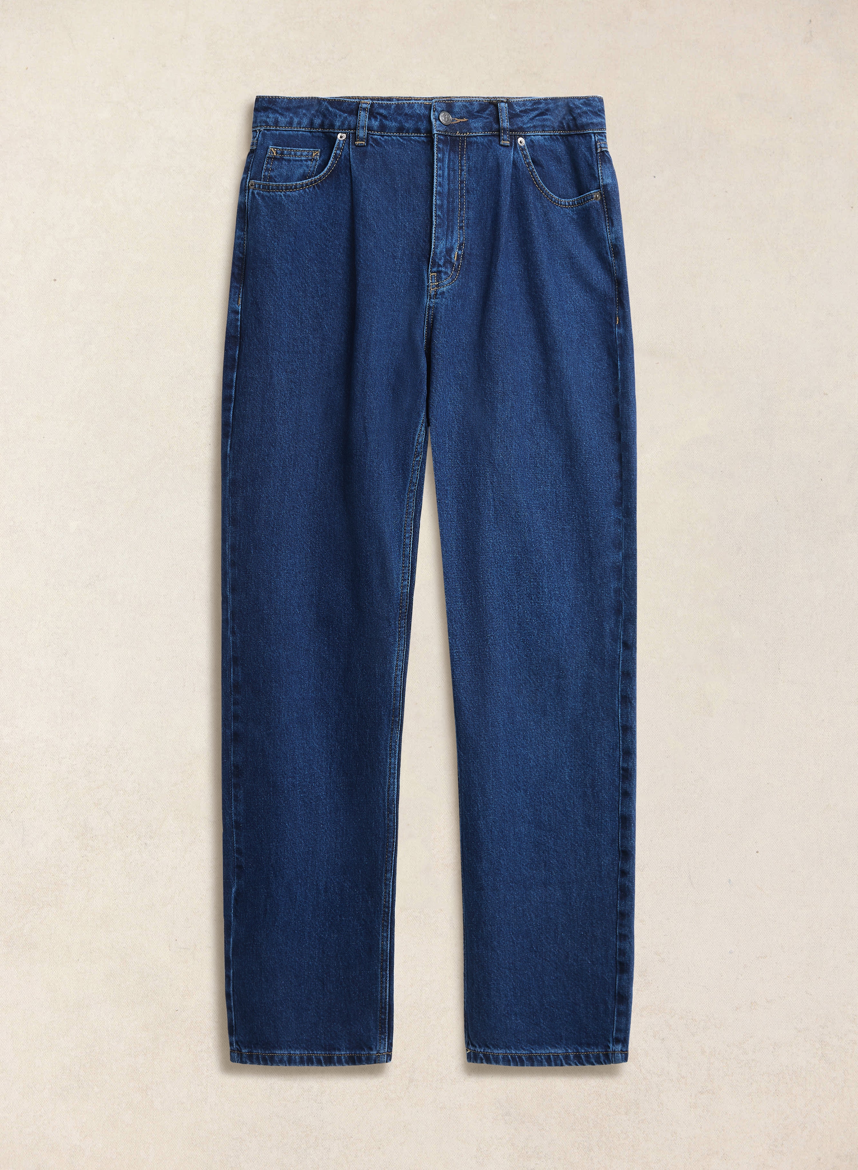 Percival Pleated Denim Jeans in mid wash blue, crafted from 12oz cotton and shown flat against a textured background.