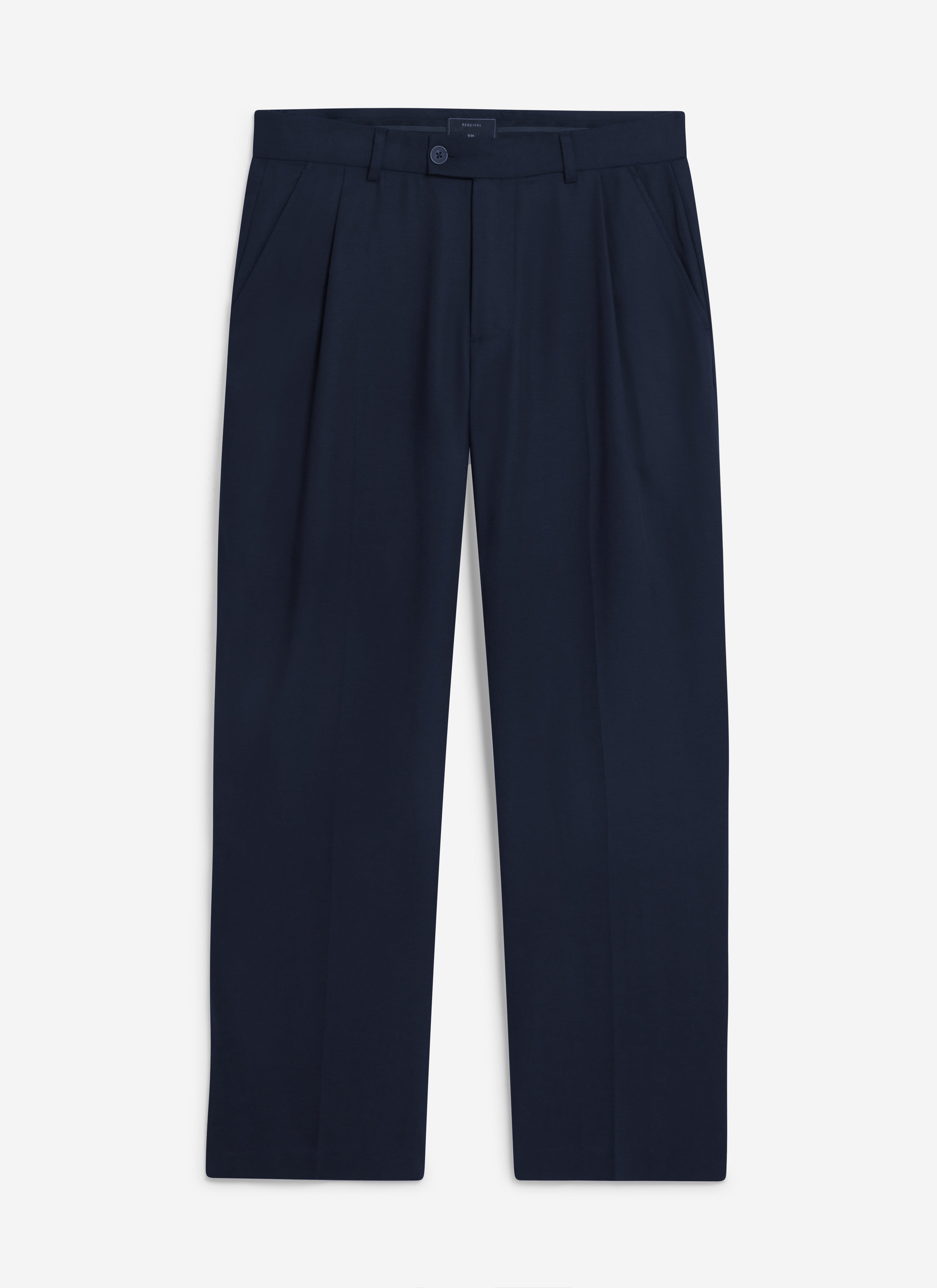 A flat lay of the Percival Pleated Leg Trousers in navy, showing the relaxed fit and front pleat detailing.