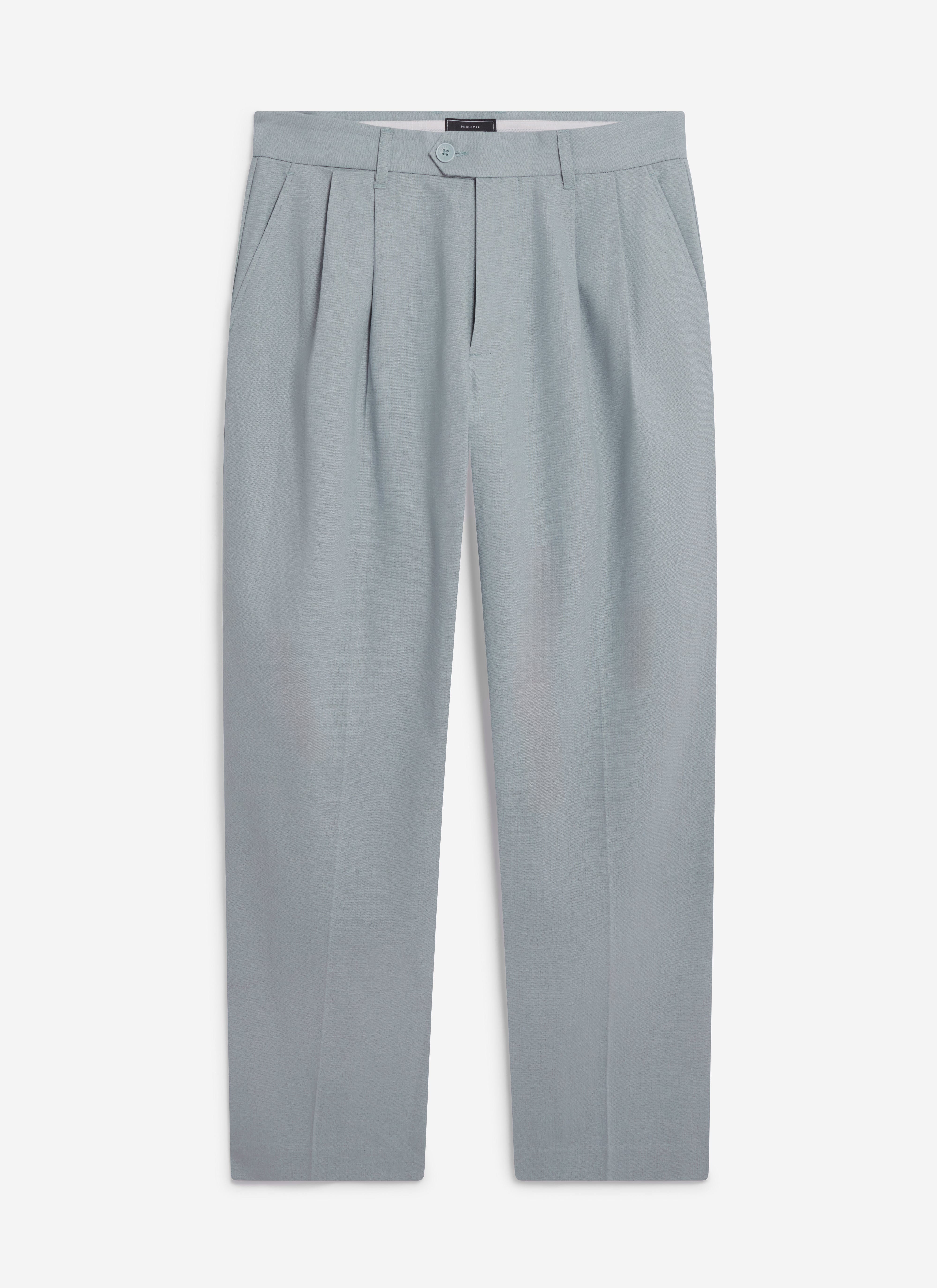 A flat lay of the Percival Pleated Tailored Trousers in a light blue linen blend, showing the front pleat detailing.