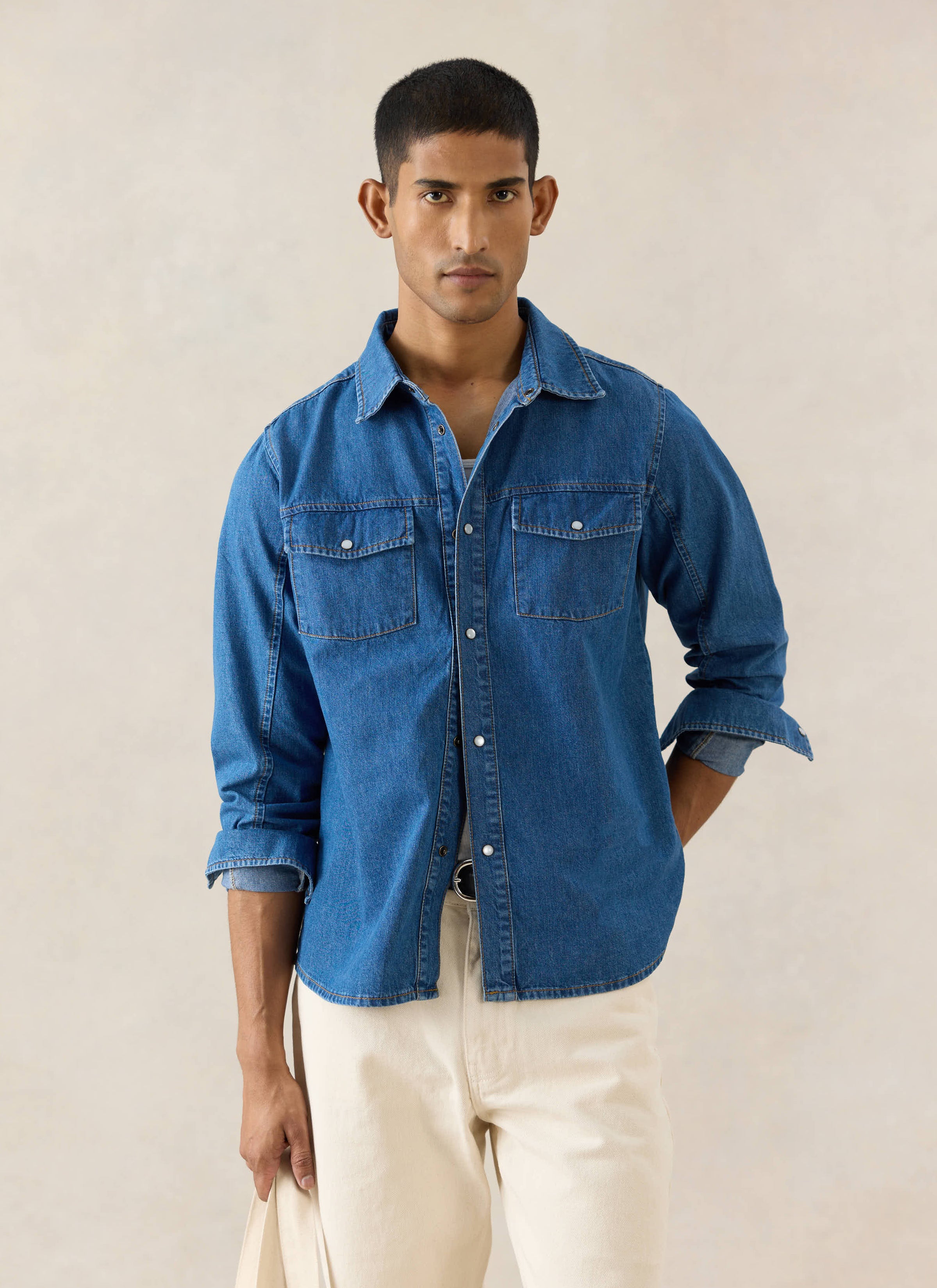 The Percival Vintage Wash Western Shirt in mid wash blue 100% cotton denim, featuring pearl detail buttons.