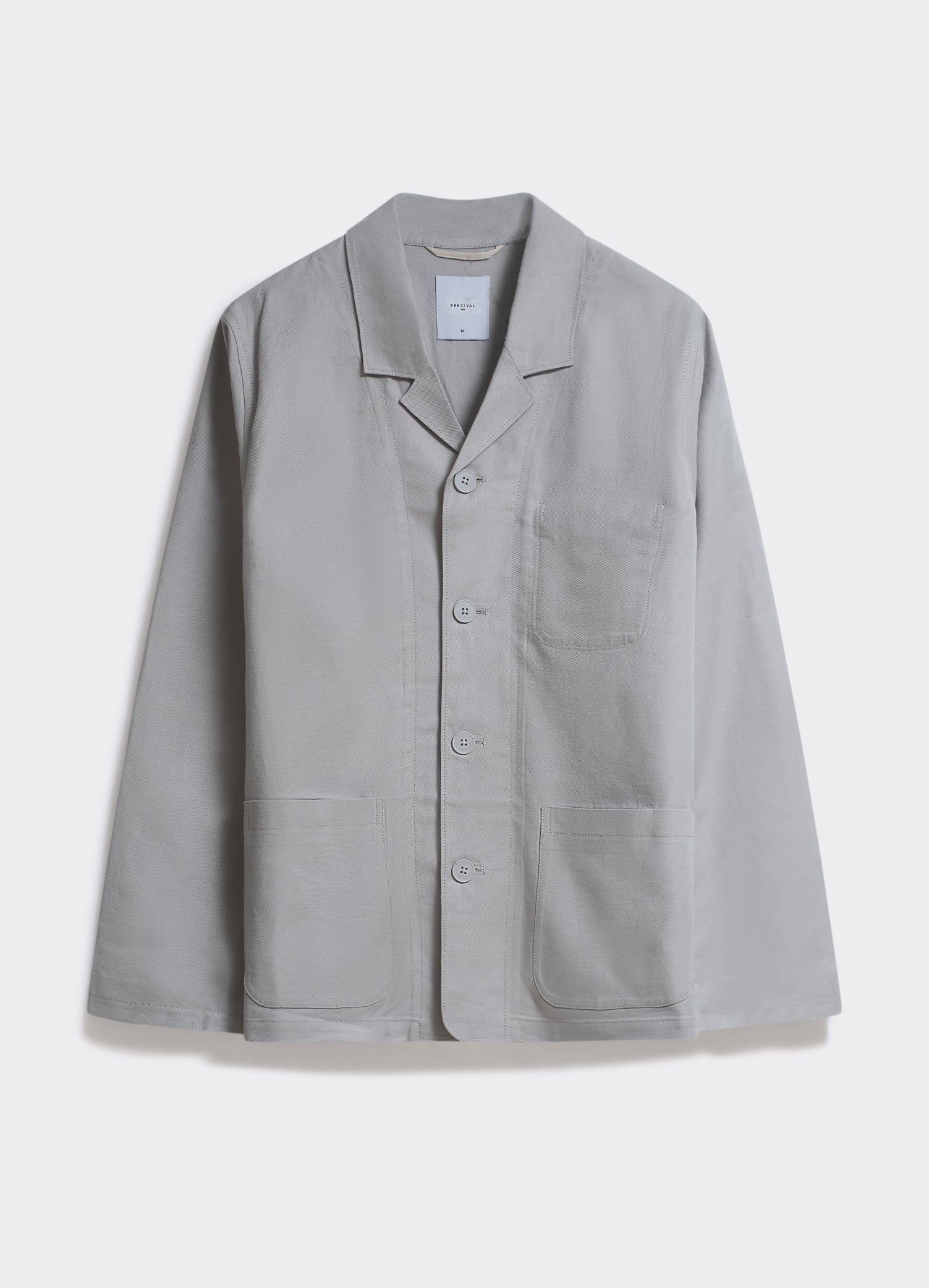 The Percival Revere Collar Blazer in stone grey, featuring an unstructured fit and patch pockets, shown flat.