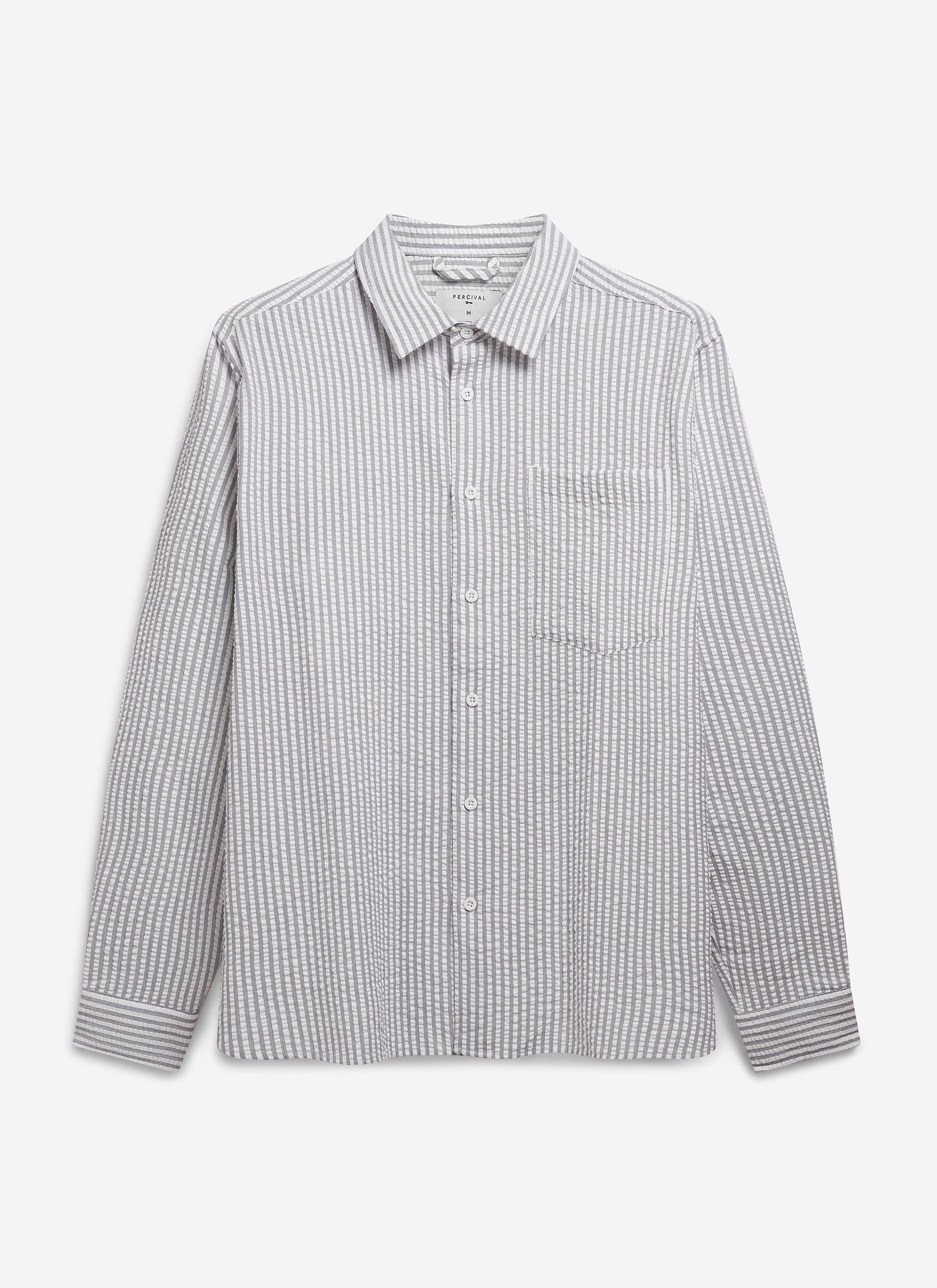 The Percival Seersucker Stripe Pearce Shirt in grey, laid flat to show its point collar, breast pocket and textured fabric.