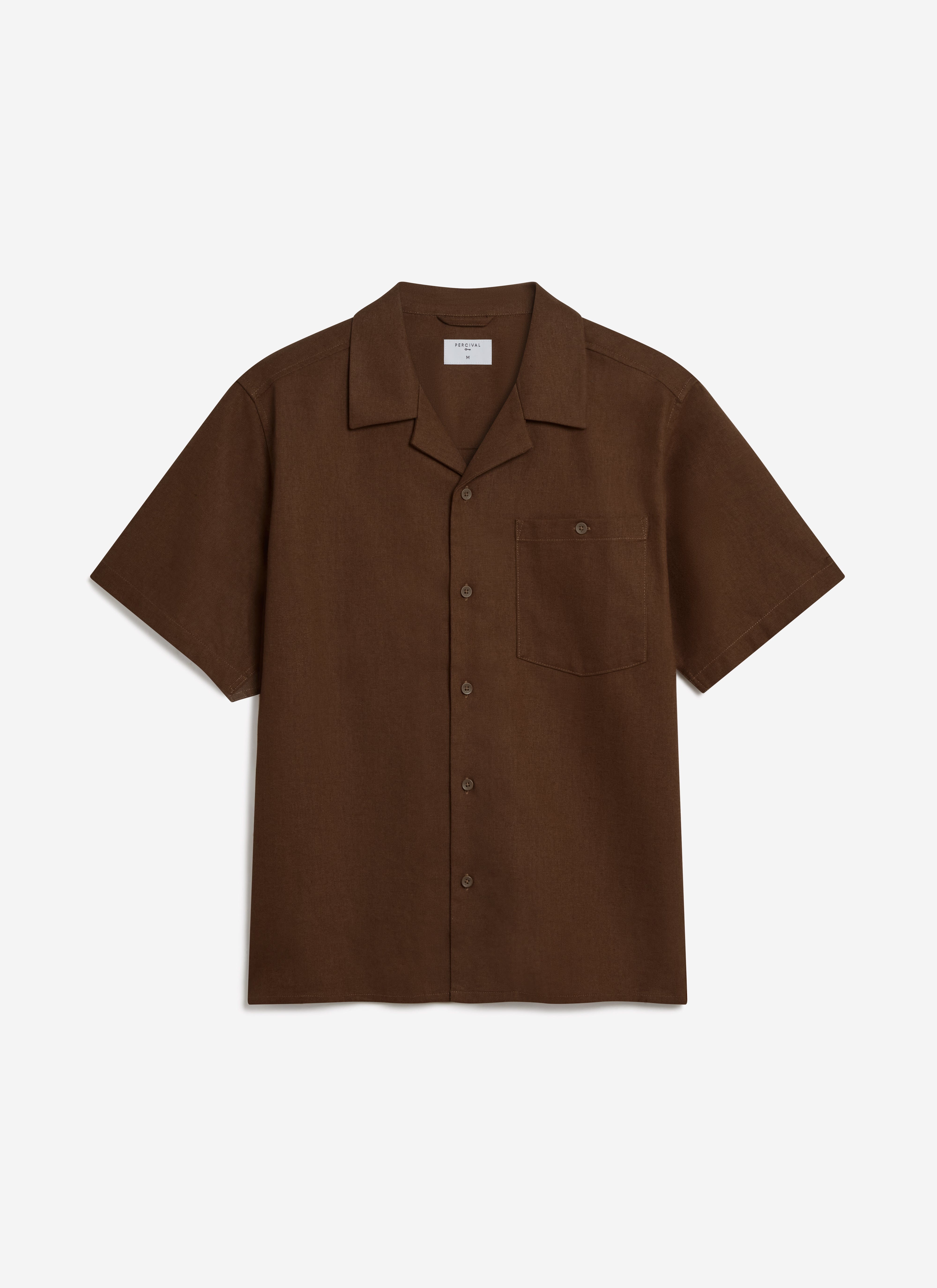 A flat lay of the Percival Short Sleeve Cuban Shirt in brown linen, showing the open collar, chest pocket, and button front.