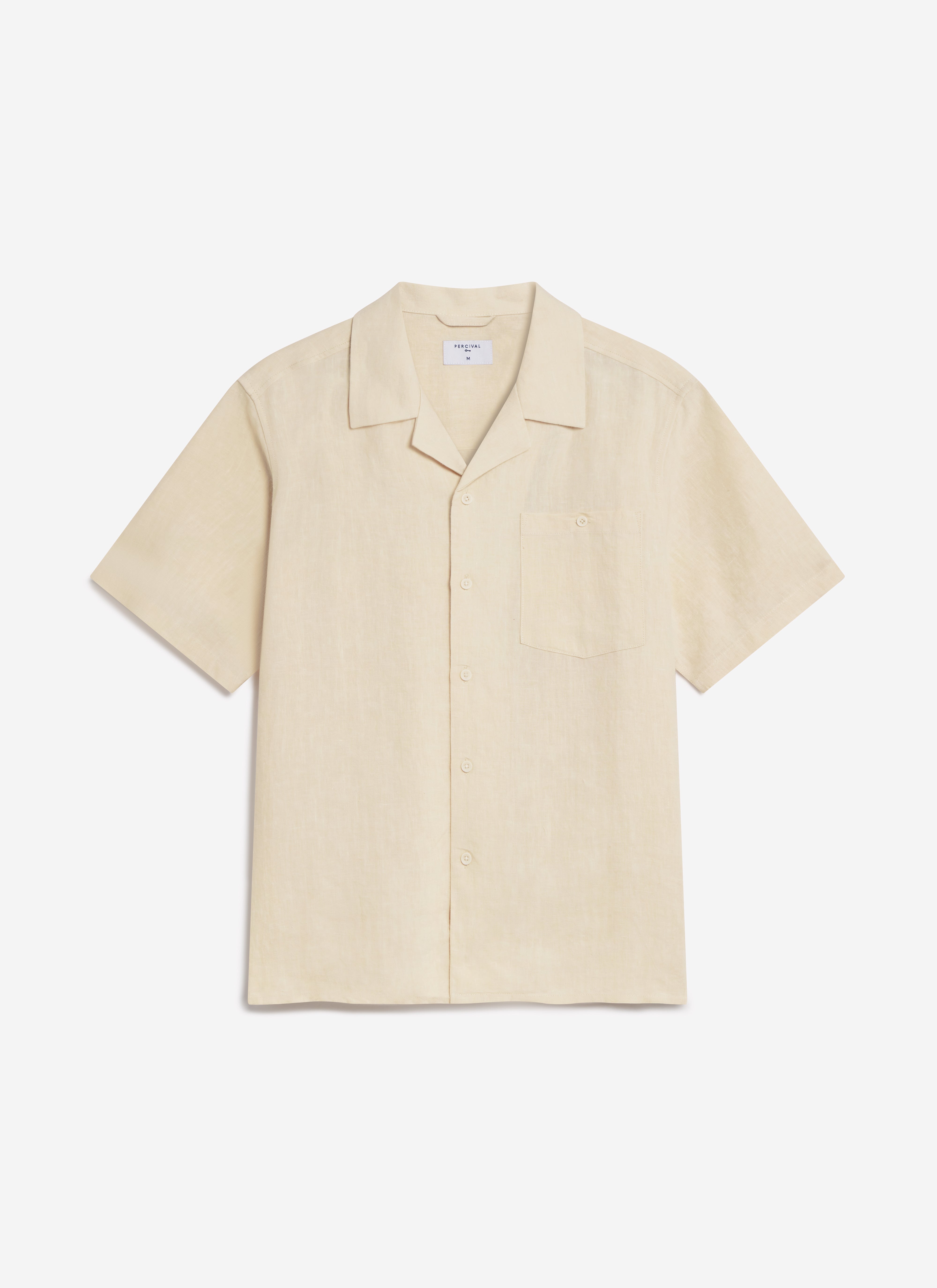 A flat lay of the Percival Short Sleeve Cuban Shirt in cream linen, showing the Cuban collar and chest pocket.