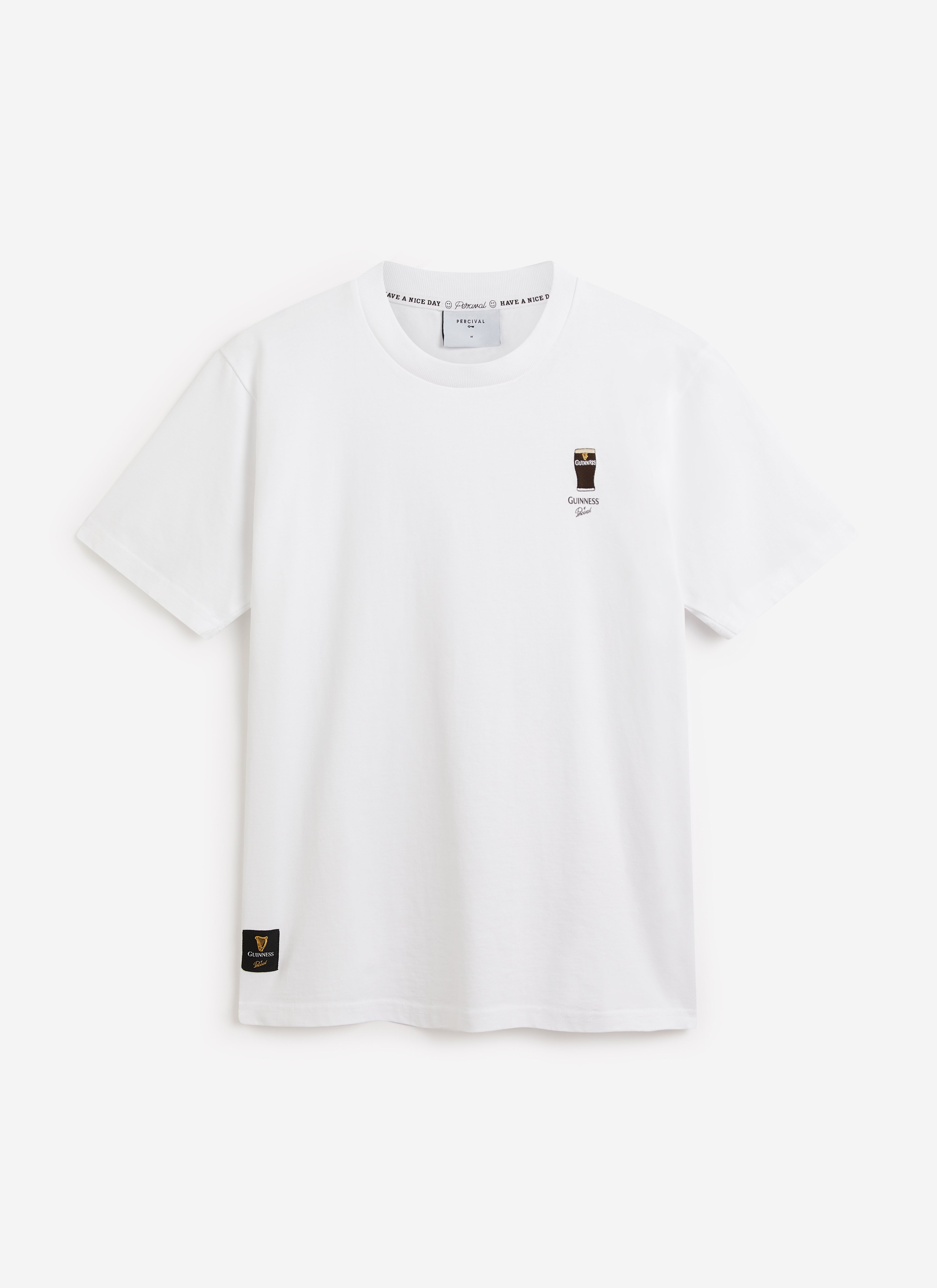 A flat shot of the white organic cotton t-shirt from the Percival x Guinness collaboration, with stout embroidery.