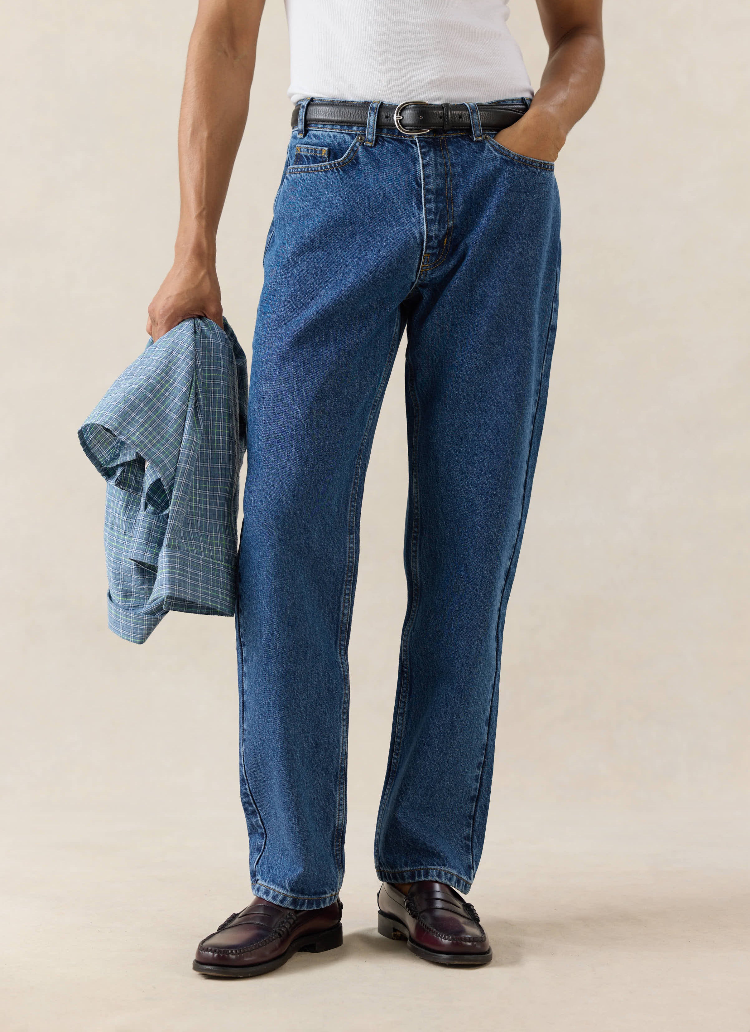 Percival Straight Leg Heritage Denim Jeans in Mid Wash Blue, a structured 14oz cotton style, worn with a white vest.