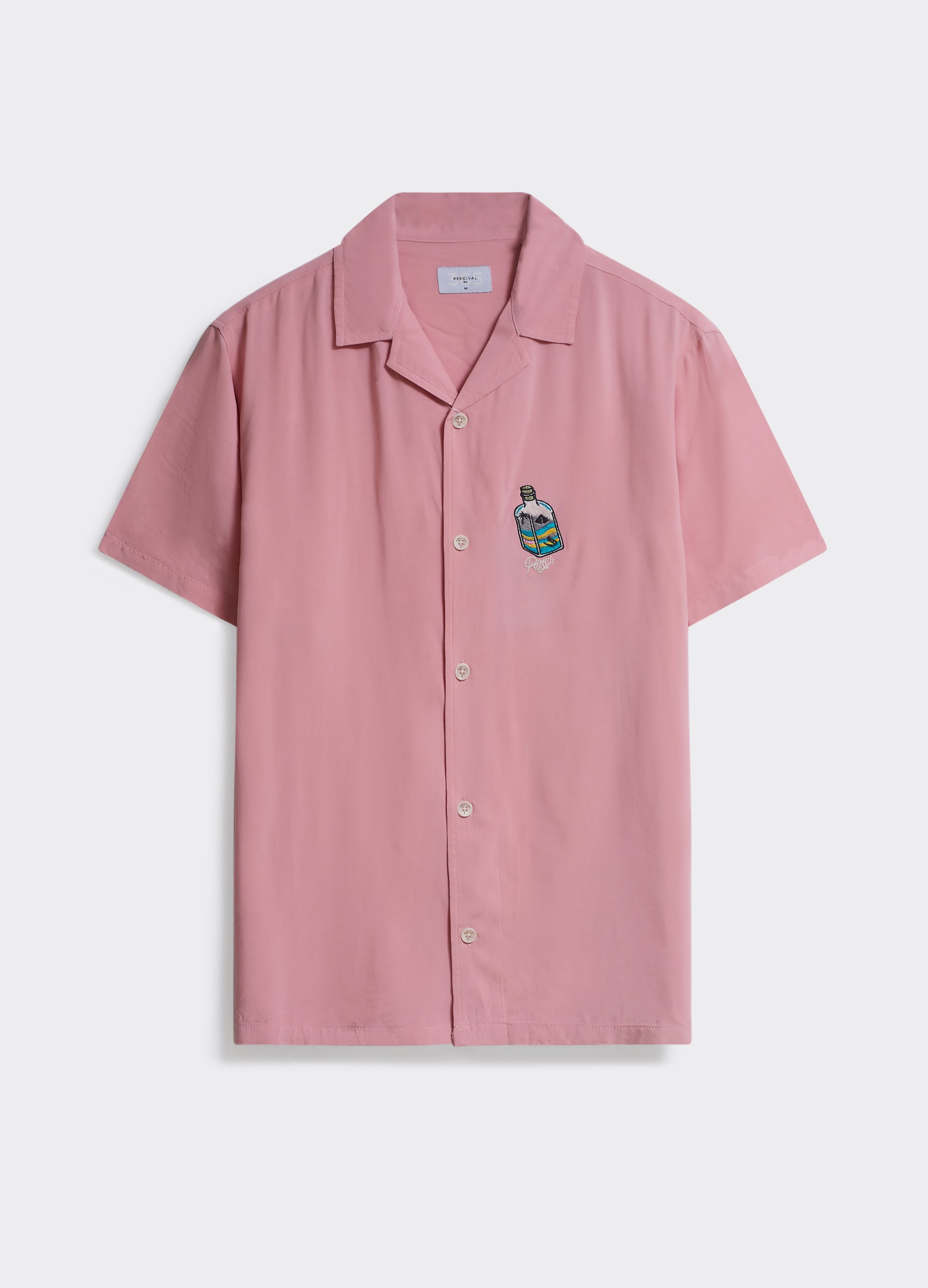 Percival Tequila Bottle Shirt in pink, a short-sleeved camp collar shirt with bottle chest embroidery, shown flat.