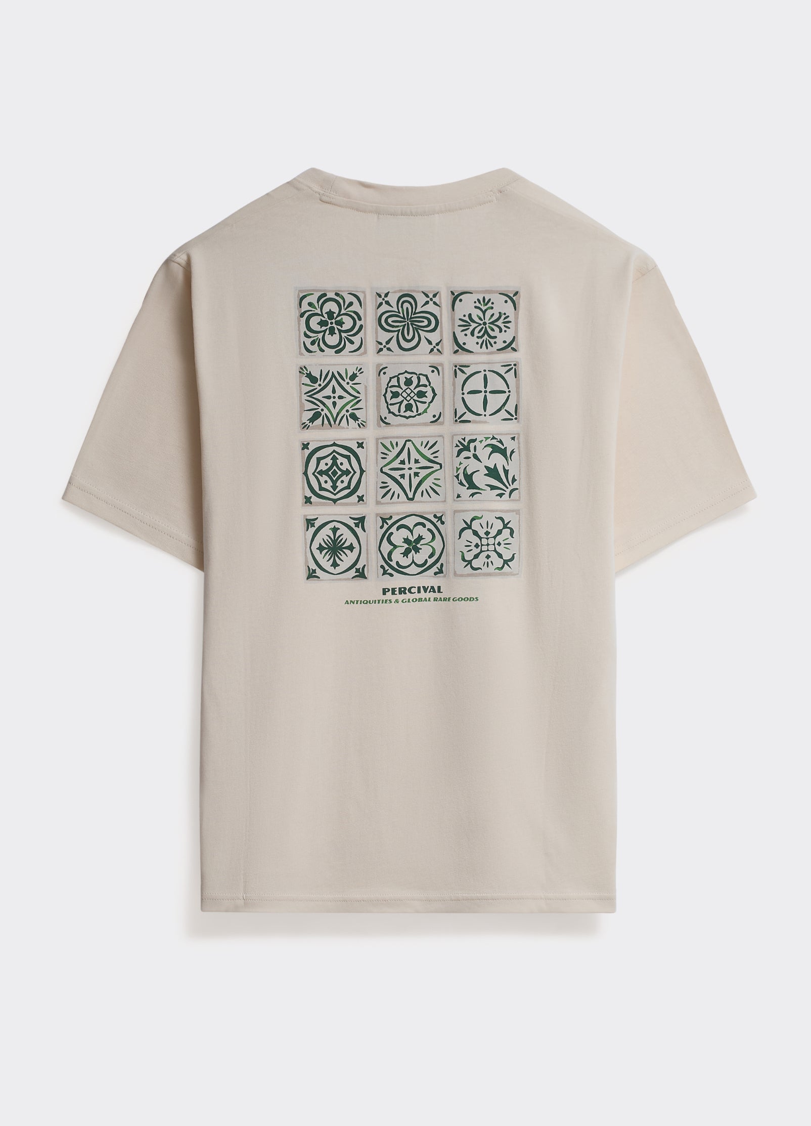 The Percival Tiles T-Shirt in off-white cotton, featuring a large green mosaic tile graphic on the back.