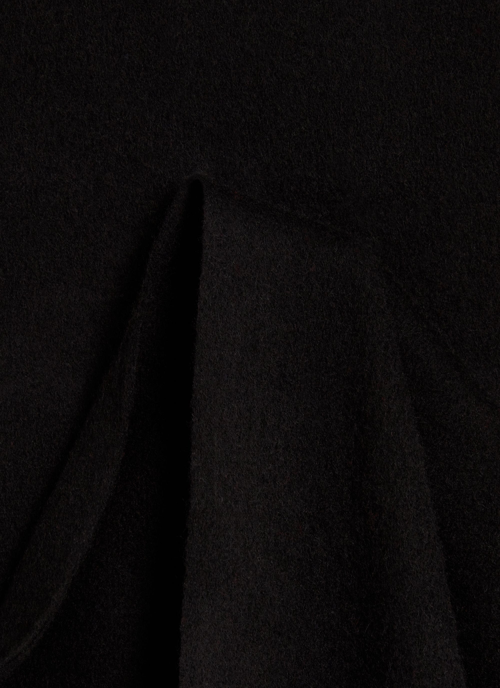 A close-up of the soft, black 100% wool fabric of the Tolkein Scarf from Percival.