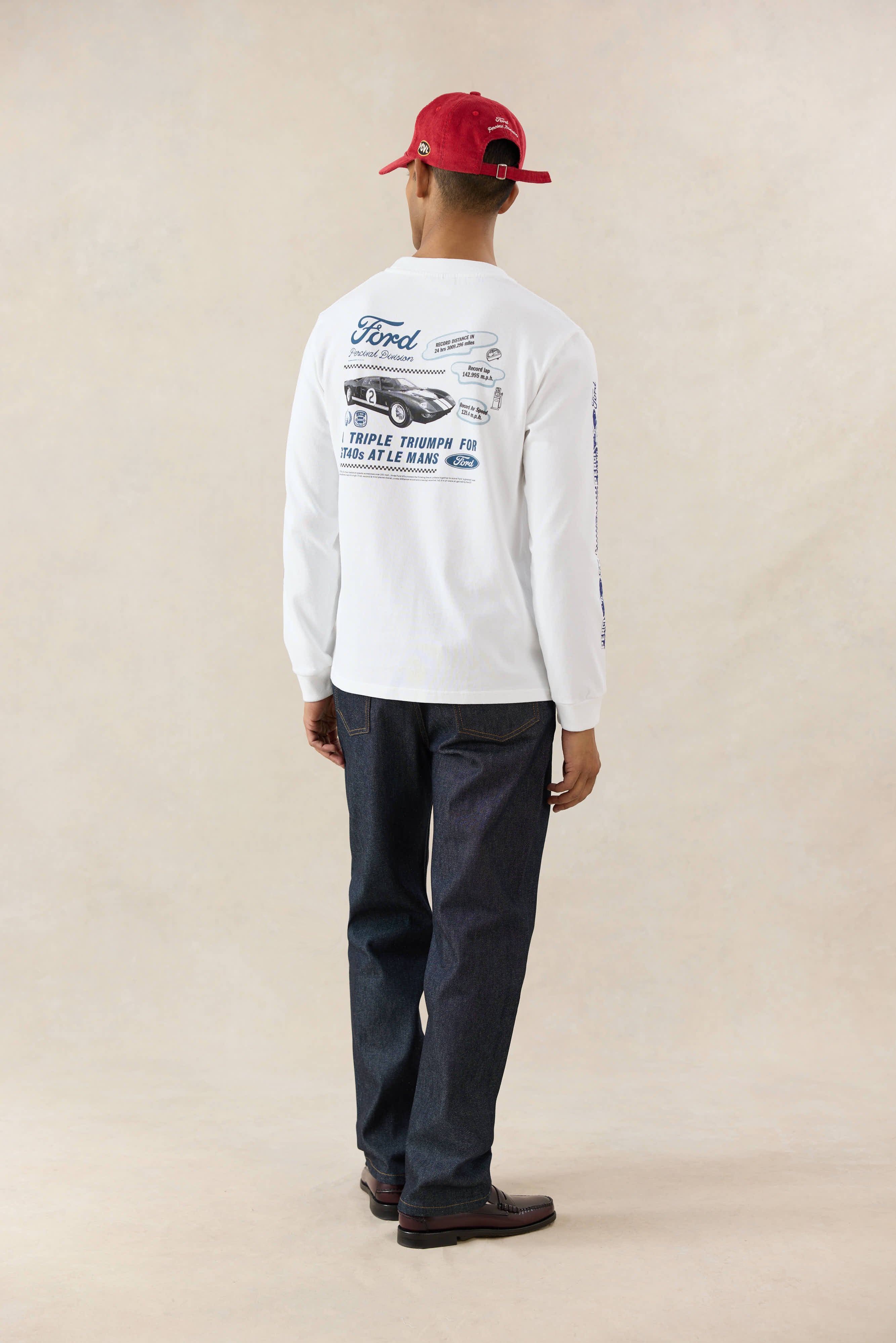 White Ford x Percival long sleeve t-shirt with a back graphic, styled with Percival raw denim heritage jeans.
