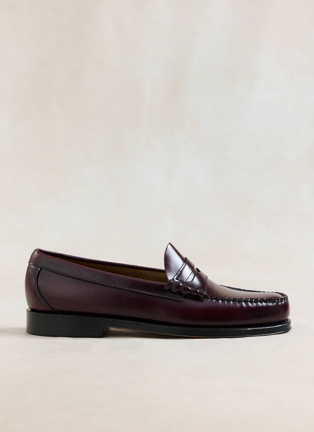 G.H. Bass wine leather Weejun Larson penny loafer shown in a clean product studio shot.