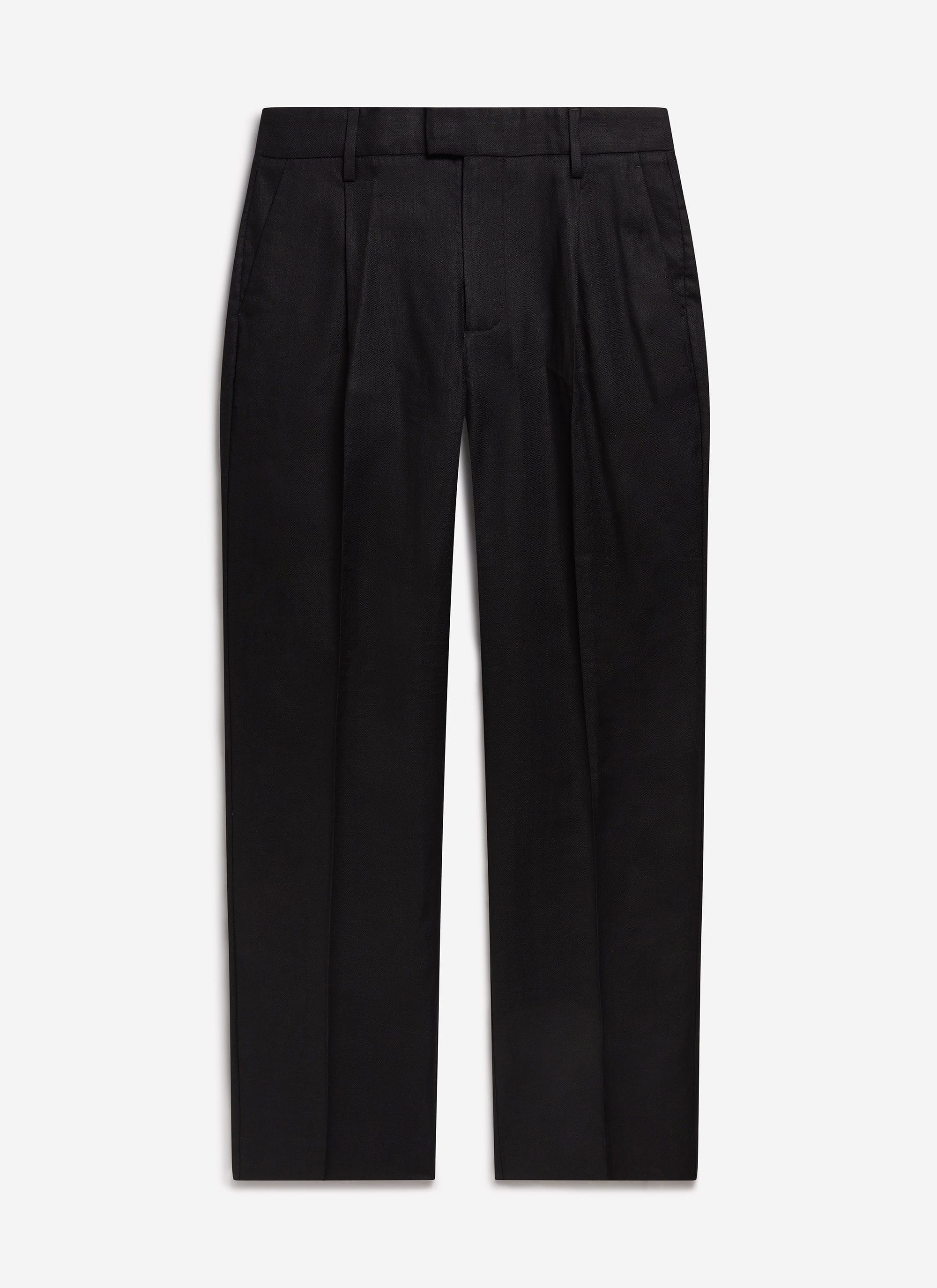 A flat-lay shot of the Percival Wide Leg Trousers in black linen, showing the front pleats and relaxed silhouette.