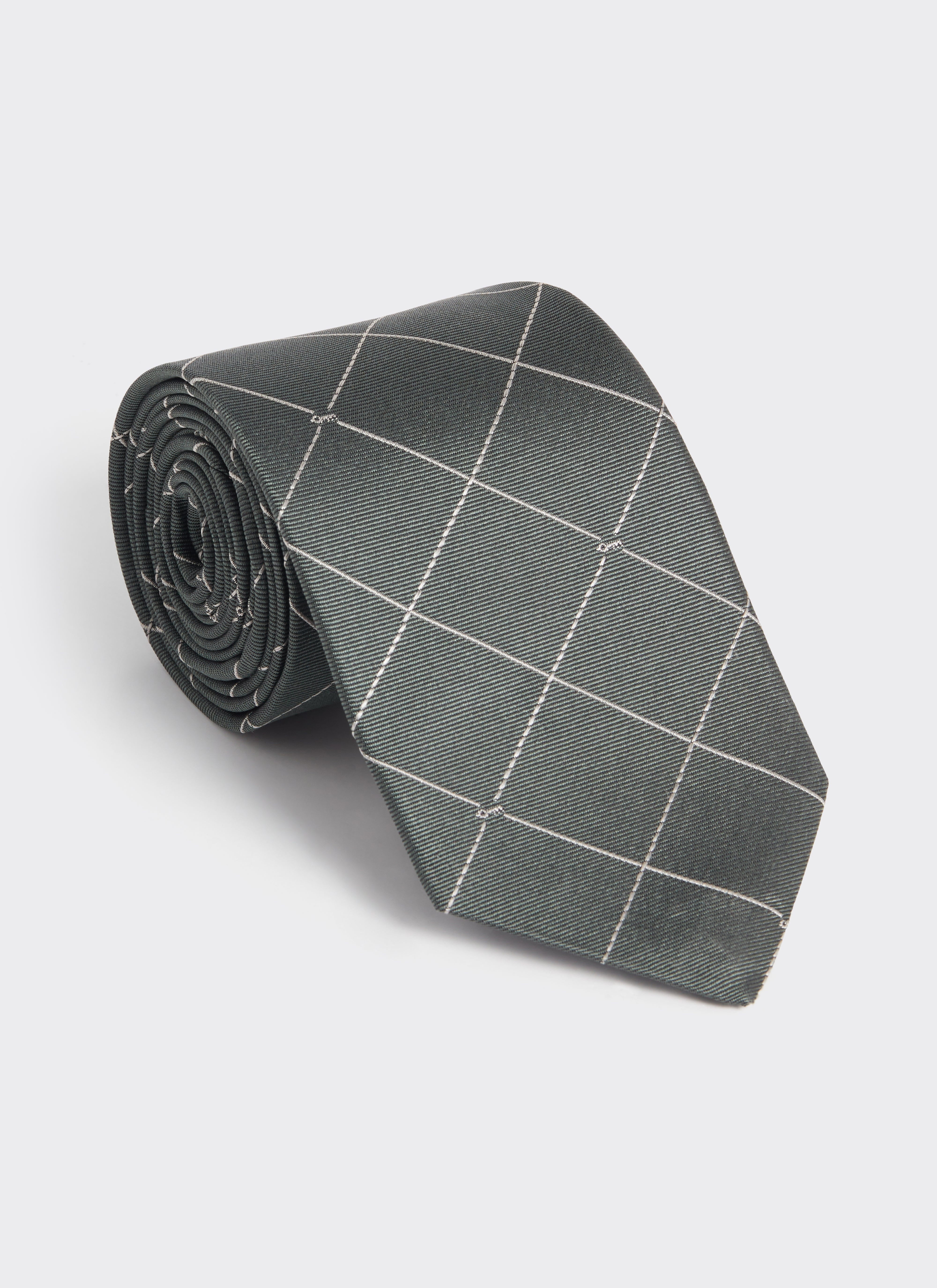 Rolled forest green silk Percival Window Pane Key Jacquard Tie showcasing the white grid and key detail pattern.