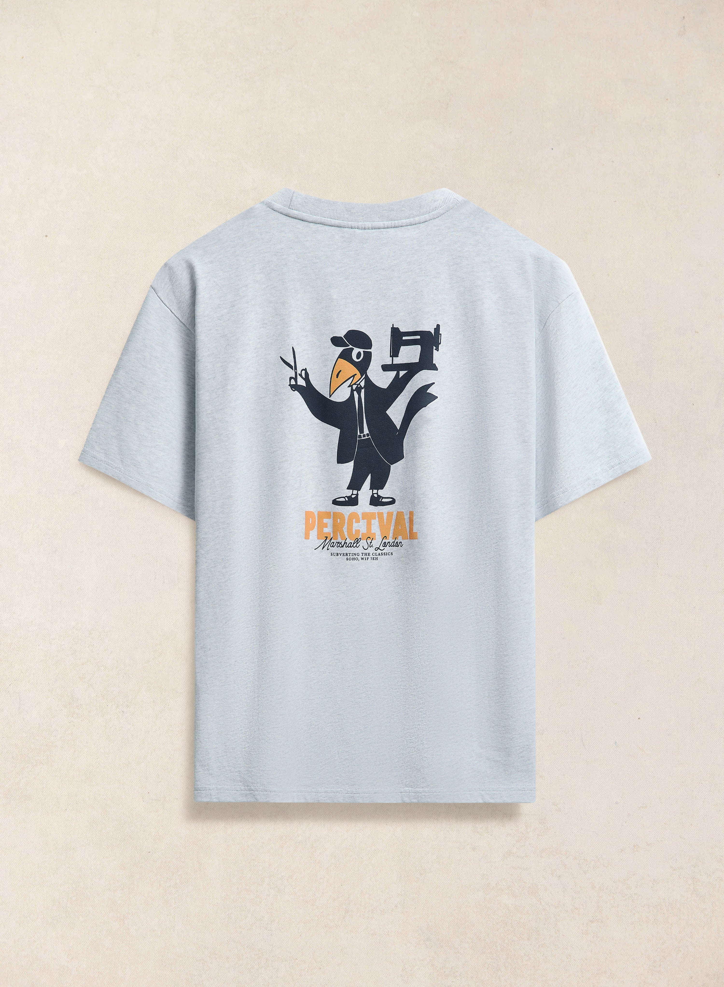 The back of the athletic grey Percival Atticus oversized t-shirt, featuring a tailors bird and sewing machine graphic.
