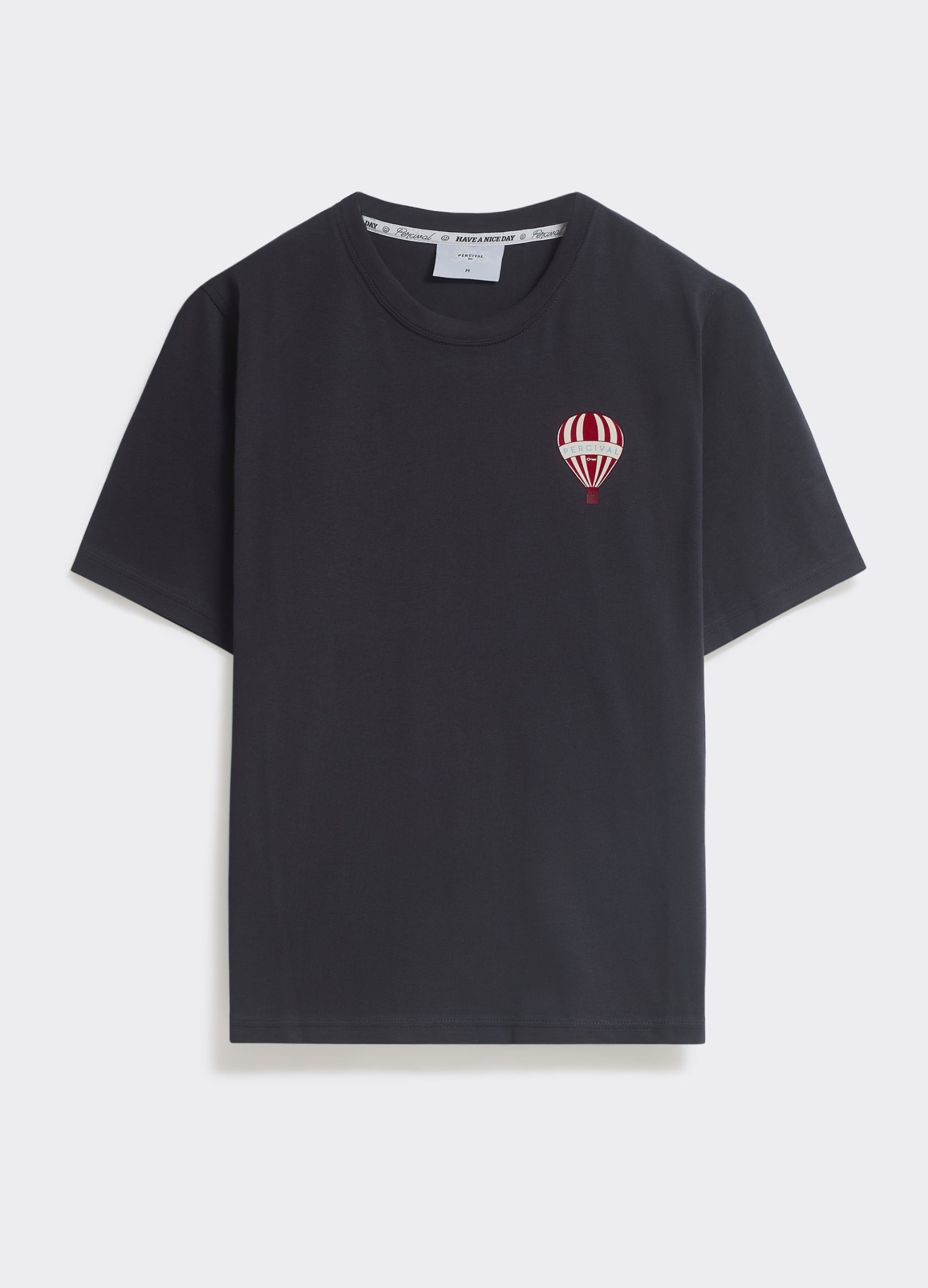 The Percival Balloon T-Shirt in washed black jersey, featuring a red and white striped hot air balloon chest graphic.