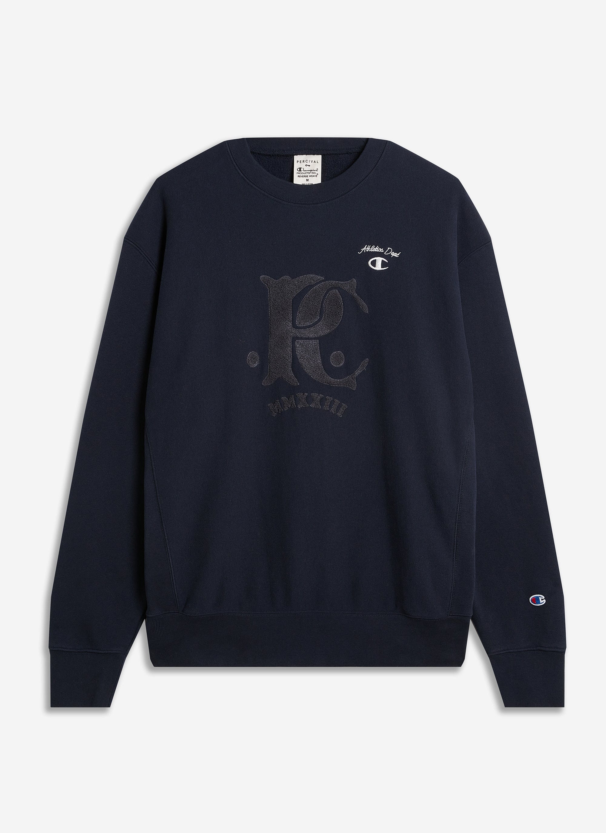 The navy Champion x Percival sweatshirt in reverse-weave jersey, with a tonal chenille patch, laid flat.