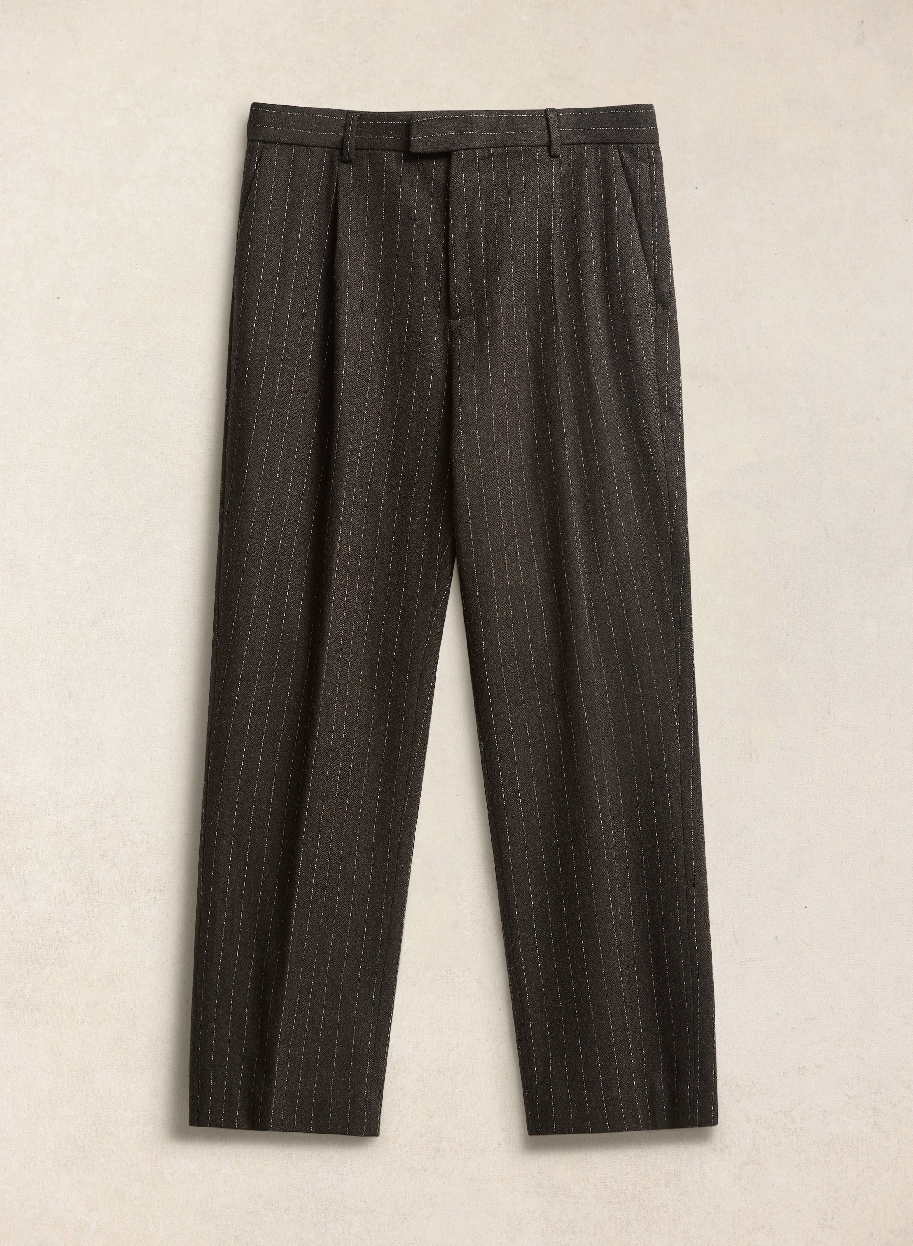 The Percival Clifton pinstripe pleated tailored trousers in espresso wool blend, featuring front pleats.